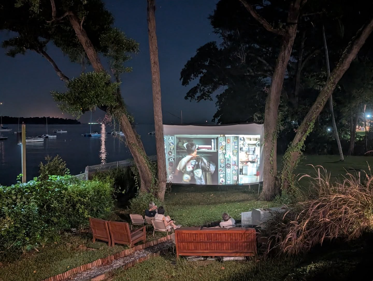 Movie screening under the sky and between Tembusu