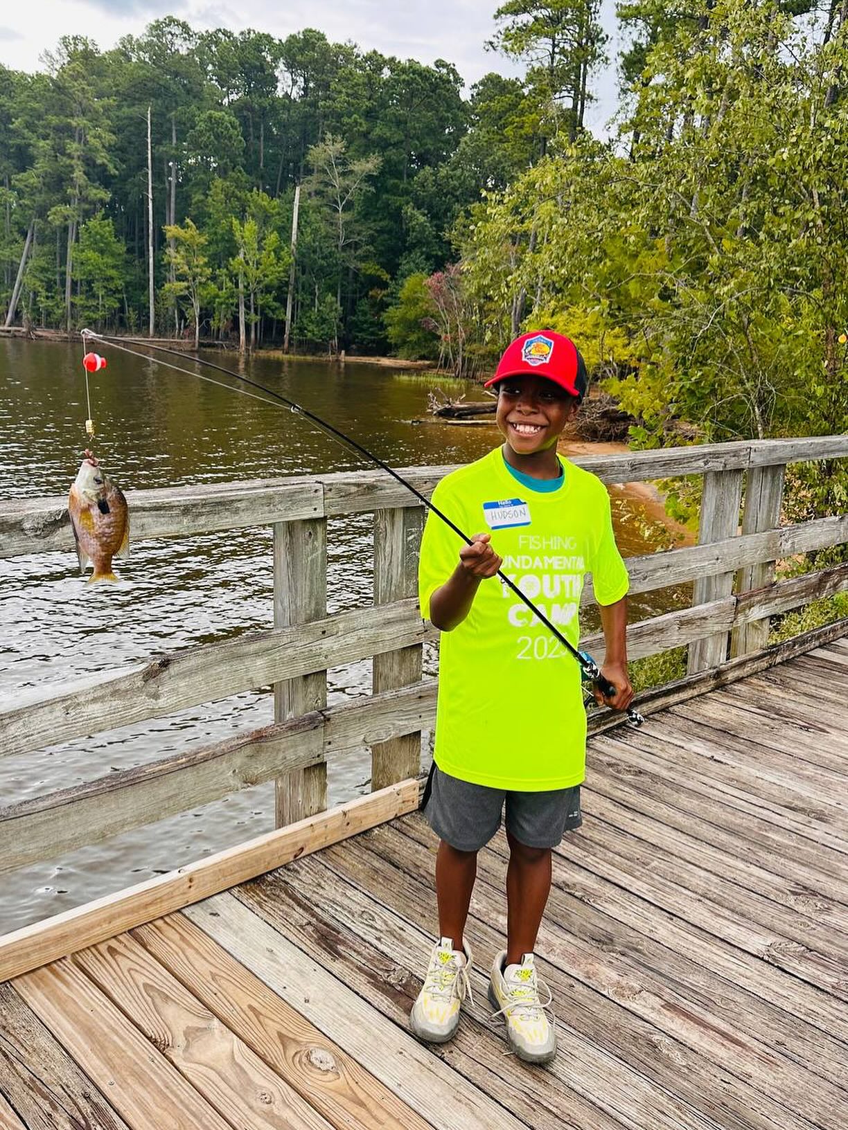 That smile says it all! 🎣 Hudson landed this beauty at Falls Lake during our FishingFUNdamentals Youth Camp, proving that patience and practice pay off. 🐟💚 #ProudCatchMoment #BlackGirlsFish #BlackBoysBoat #EbonyAnglers #FishingFUNdamentals #YouthFishingCamp #FallsLakeFishing #OutdoorEducation #FishingWithKids #BlackKidsFish #FutureAnglers #CatchOfTheDay #NorthCarolinaOutdoors #FishingLife #BoysWhoFish #FishOn