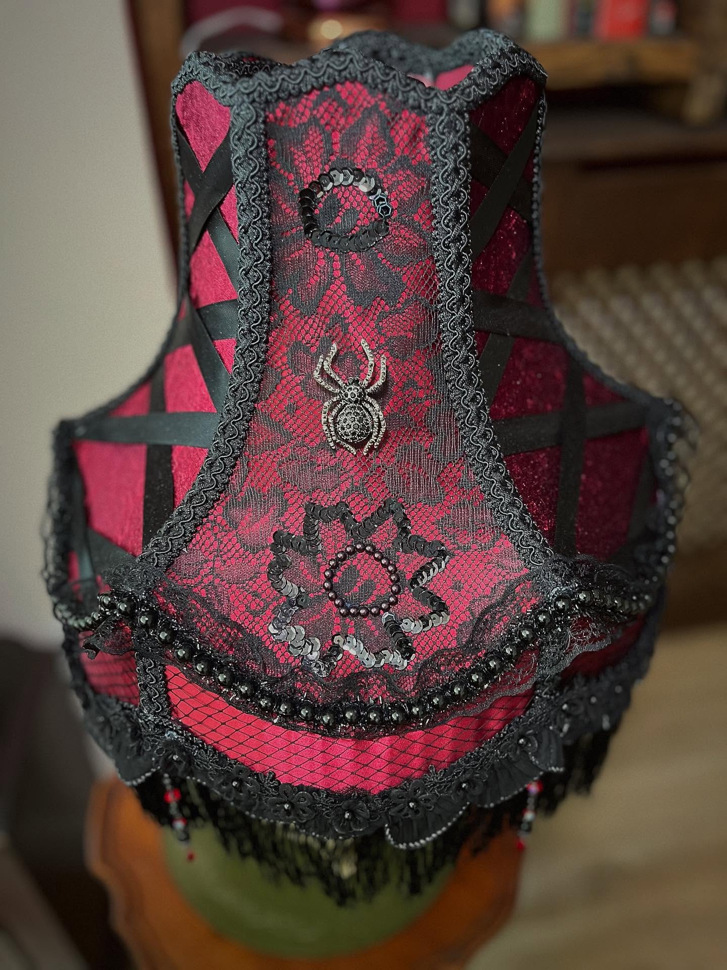 .
Name: Drusilla (Meaning - Strong/Courageous/Valiant)
Colour: Red/Black
Lamp Frame: Scallop 13”
Lamp Style: Table Lamp
Category: Gothic Burlesque
£305.99
Go to www.ritzyroguelampshades.co.uk