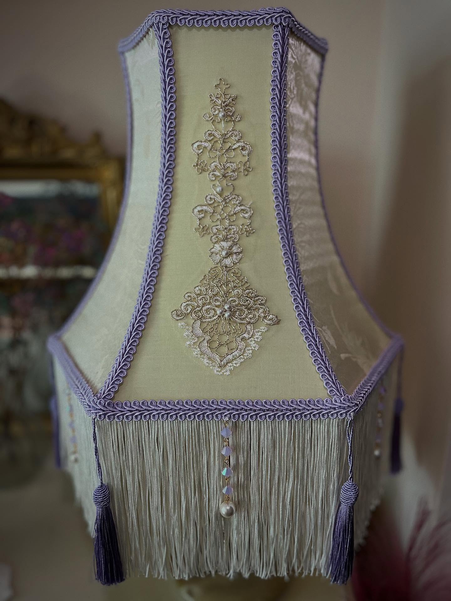 .
Name: Violet (Meaning - Beauty/Grace/Purple)
Colour: Lavender/Cream/Pearl
Lamp Frame: Fancy Square 14”
Lamp Style: Table Lamp
Category: Vintage Glamour
£280.99
Go to www.ritzyroguelampshades.co.uk