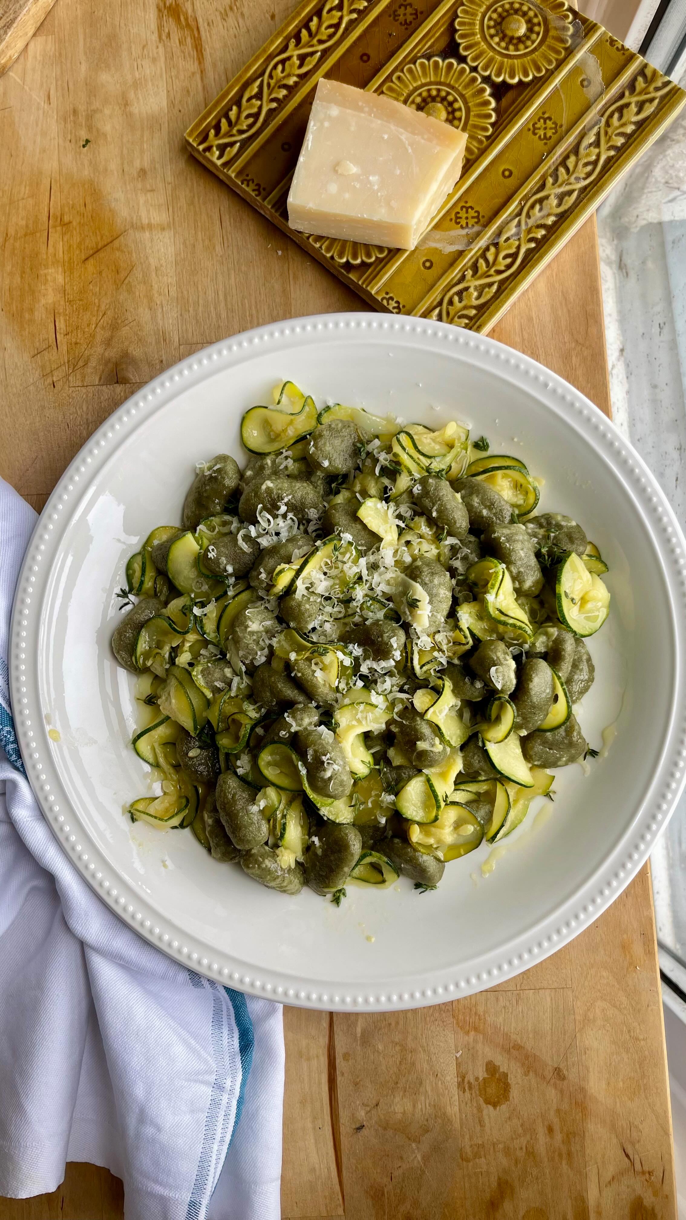 Courgette & Miso Gnocchi
It’s late, you’re tired, and all you have is a lonely courgette in your veg drawer.
All you need are some kitchen essentials to turn this courgette into a life saver dinner 🫶
You’ll need -
1 large courgette
Extra Virgin Olive Oil
1 large garlic clove
1 heaped tsp miso paste
Half a lemon
A few sprigs of thyme if you’ve got them
Sunny & Luna Spinach Gnocchi
Parmesan for grating
Mandolin your courgettes into thin slices and cook in oil and salt over a medium heat until starting to soften. Add thinly sliced garlic, miso paste and some water and return to the heat, stirring to incorporate the miso. Cook down until caramelising and lighten up with a squeeze of lemon.
Meanwhile, pan or air fry Sunny & Luna Spinach Gnocchi in a little oil for 5 minutes. Add to the courgettes, season and grate in some Parmesan to emulsify into a sauce.
Serve and enjoy!