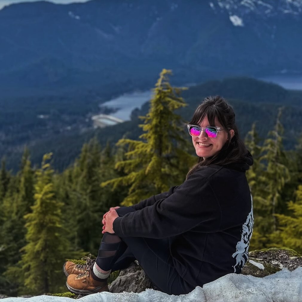 Meet Danielle McCaffrey, one of the incredible facilitators joining us at this year’s Women’s Moto & Wellness Summit!
Born Deaf, ASL has been Danielle’s first language and a core part of who she is. She’s passionate about creating inclusive, accessible spaces where people feel seen, supported, and empowered to communicate in new ways.
At the summit, she’ll be leading a beginner friendly ASL workshop. No experience needed, just curiosity and an open mind. Whether you’ve never signed before or you’re simply interested in learning something new, this is a space for connection, culture, and communication.
Outside the summit, Danielle works at a Deaf school and as a Deafblind intervenor, supporting individuals with both hearing and vision loss. She enjoys camping in general but especially loves the solitude and beauty of backcountry camping. Hiking, exploring nature, and time outdoors are a big part of what recharges her.
Oh and she holds a motorcycle license too! She may not own a bike yet, but she knows the thrill and freedom of riding… and finds that same kind of freedom in language.
We’re so honored to have her with us this year. Say hi at the summit or connect with her on Instagram: xo.wanderlust.xo