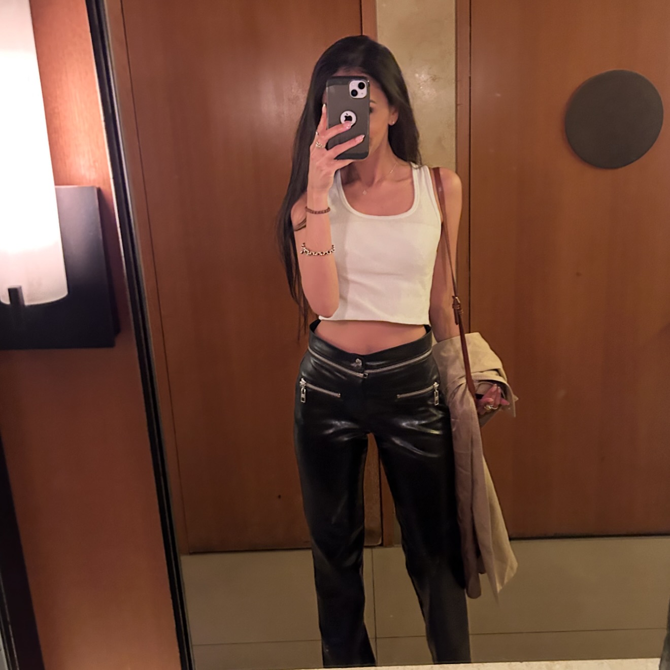 Yes this is a simple outfit. It’s a white top and black trousers. What makes it different/ something that worked for me?
I shortened the top by tucking it up to show a tiny bit of waist.
The black trousers added a different texture to play with, making them a little more interesting than just standard black pants.
The heels were high to make my body and posture look more put together (I kept hotel slippers in the car ofc).
My cool undertone was complimented with silver bits of jewellery.
Classic trench, but these can be made interesting - ive don’t a reel on this