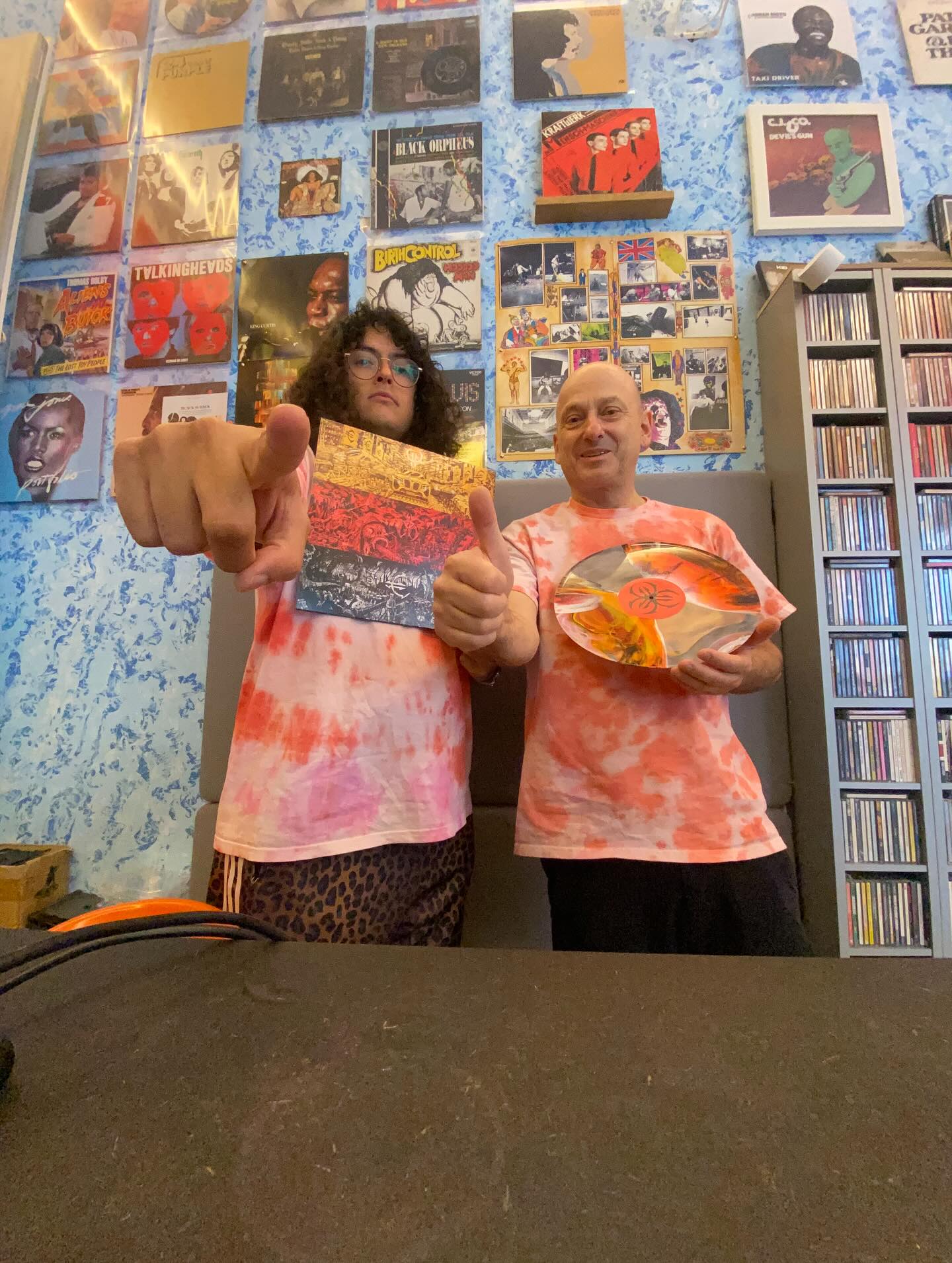 we got this sick @deutschlandg.m.b.h merch and have been wearing it like a uniform and tbh, it’s so sick. Brought my own record to play it at the shop today! Fun fun punk.