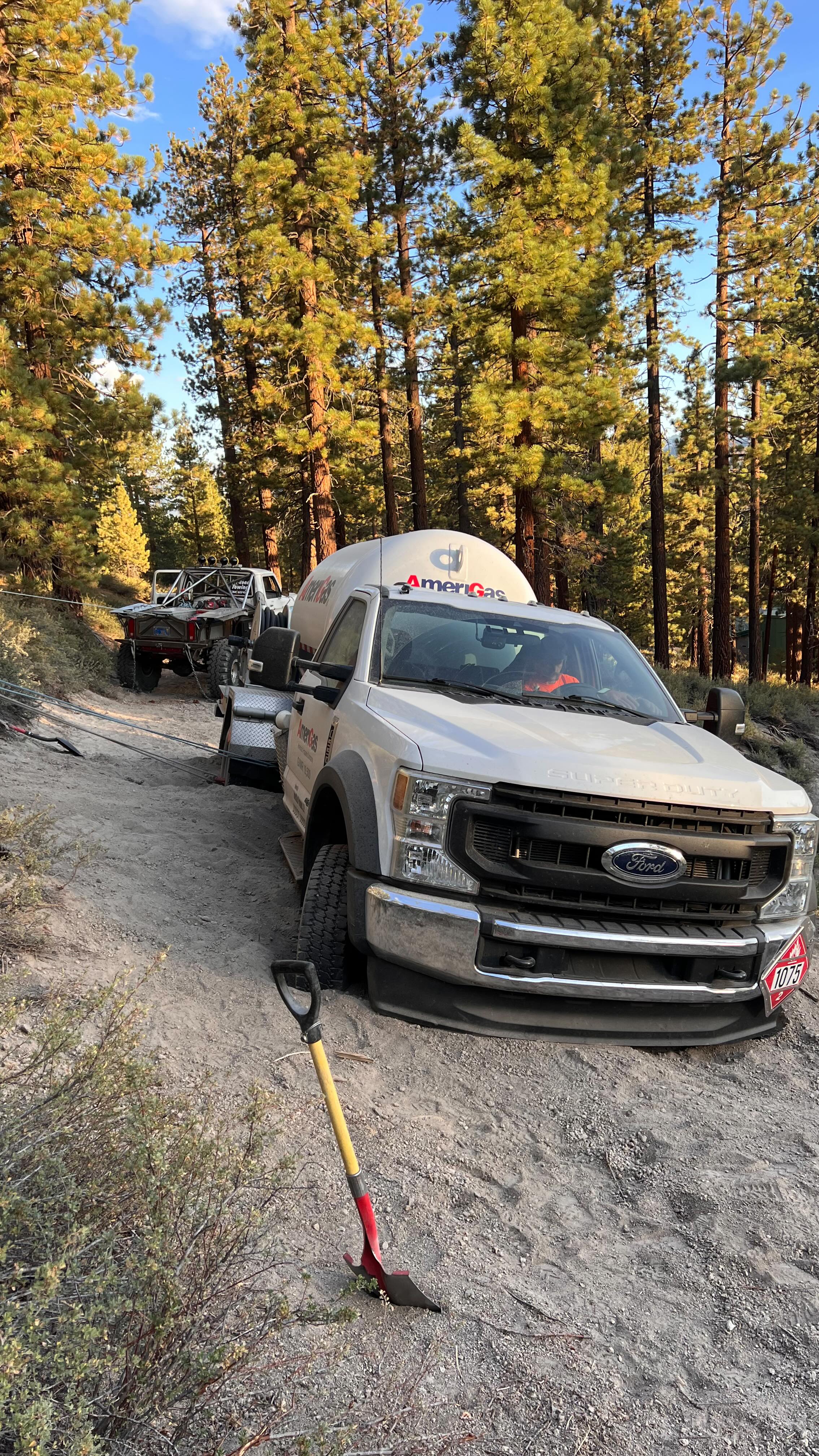 A fun, technical #vehicle #rescue On the way to refill a satellite station, the driver lost track of the main road amongst a maze of turnoffs. Less than a quarter mile from the hwy and I even had a hard time getting to him 😂😜
Once on site we formulated a plan that would get the truck back on the road without physical injury, vehicle damage or damage to the surrounding area.
The road here will continue to erode and become impassable despite there being minimal vehicle traffic.
Quick 3:1 with a redirect and some fiddling with a reliable attachment point and we started moving the rear end over inch by inch. The front axle was buried up to the passenger knuckle and the rear was passed the differential. The passenger side was resting on the frame, so we really had to excavate a lot of material to clear a path to free up some of the resistance.
Once the rear end was back up on the road, we tried a little reverse action. The truck did not like that and immediately the front end started to slide down. We rigged up a pendulum of sorts to pull the front and rear at the same time all while keeping our 3:1 advantage.
Got er over to the hard pack and finished the rescue with a straight pull back. This rescue really put the hurt on some of our equipment despite being a relatively light vehicle. The combination of working against gravity and how mired the truck was really upped the load #frosty4wheeler #offroad #recovery #easternsierra
