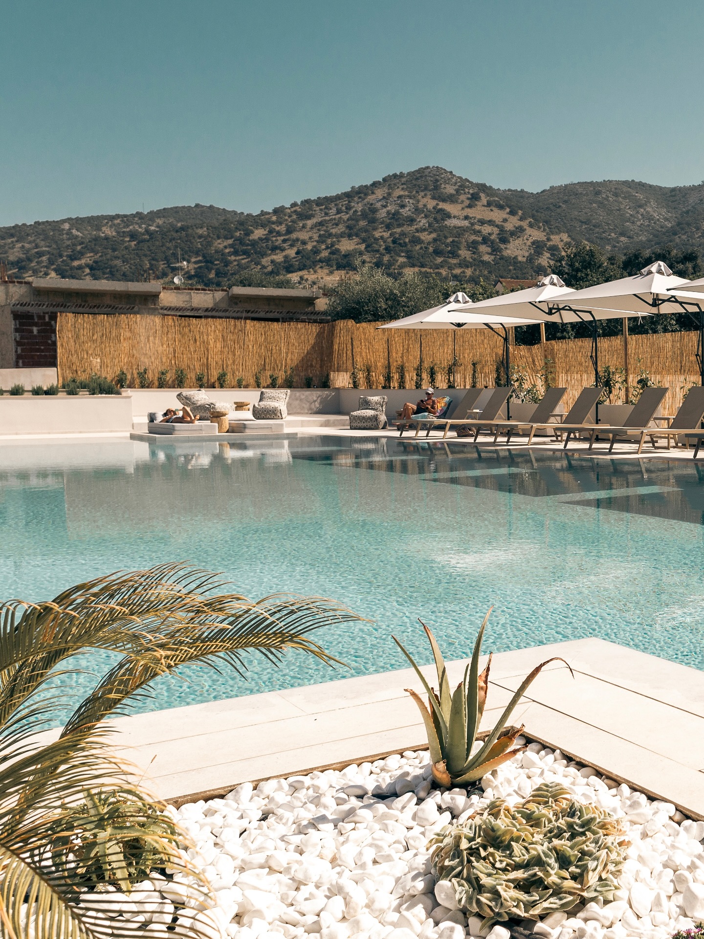 Enjoy a serene escape at the Sivota Hotel.
Relax by the clear blue infinity pool, surrounded by peaceful landscapes.
Unwind on a sun lounger with a refreshing drink and a plate of fresh fruit, and soak up the calm atmosphere.
It’s the perfect place to find your peace.
www.hotelsivota.gr