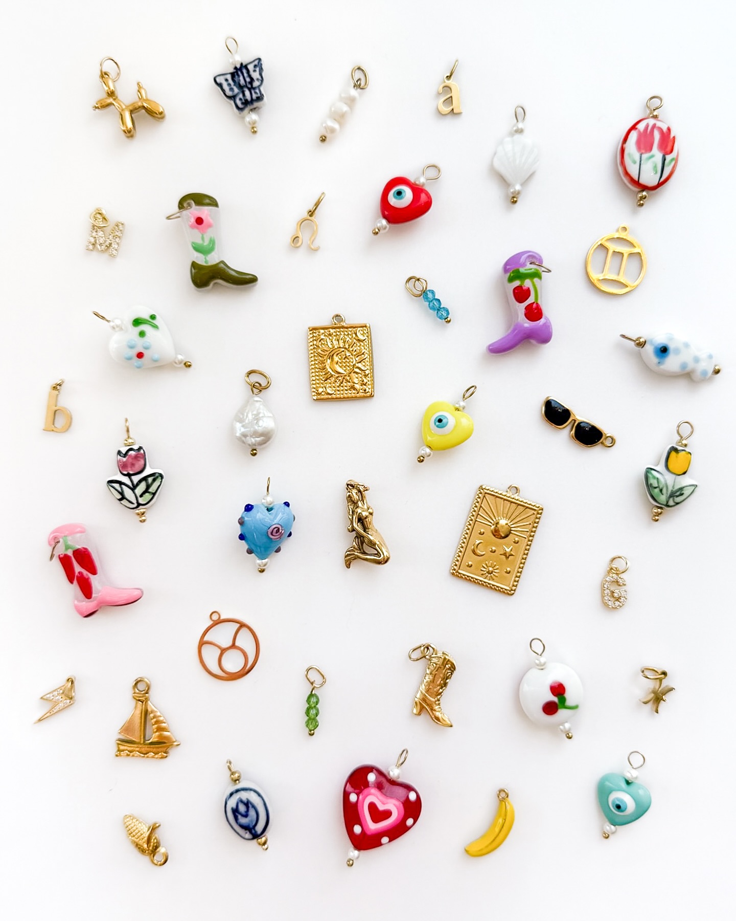 New Charms Alert! 🚨 The charm bar is fully stocked with the coolest new charms! Book your appointment to create custom piece—or stop by and add a little something new to your stack! #charmbar #charmnecklace #charmbracelet