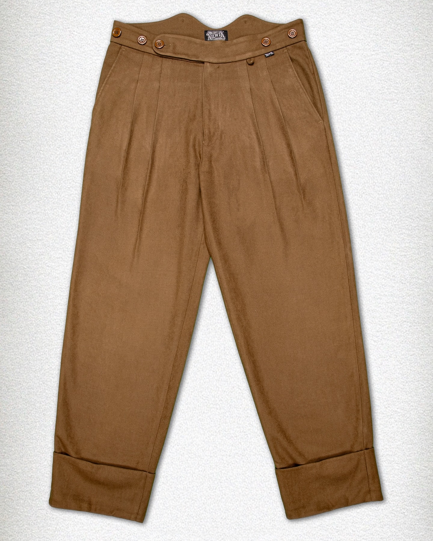 On high demand:
The Holback.
Loose Fit Trousers with Fishtail Waistband
The Holbeck pays homage to the craftsmanship of the early 20th century — think the 1920s, when style met substance. Cut from a rich wool blend, these trousers are designed with a loose fit: comfortable through the thigh with a straight, generous drape that reflects the tailoring of the era. The high fishtail waistband, complete with sturdy brace buttons, echoes a time when trousers were made to be worn with purpose — and suspenders.
The legs finish in a pronounced turn-up cuff, a practical detail of the past that today speaks to enduring style.
Available in three deep, character-rich tones:
Charcoal Grey – sharp, versatile, and understated
Coffee Brown – warm, refined, and full of depth
Forest Green – earthy, bold, and grounded in tradition
For those who understand that true style doesn’t rush.
#heritage #rugged #fishtaletrousers #trousers #vintagestyle #loosefit #workingclass #classic