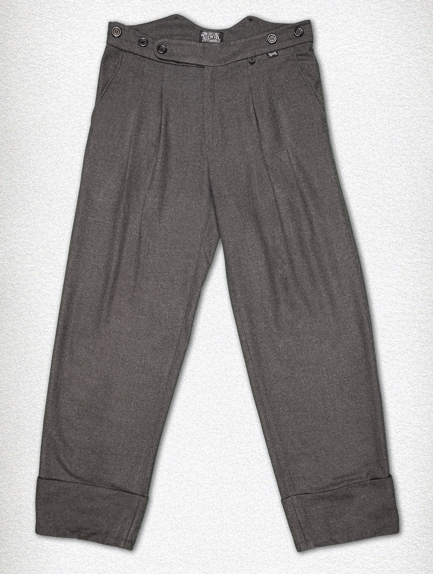 On high demand:
The Holback.
Loose Fit Trousers with Fishtail Waistband
The Holbeck pays homage to the craftsmanship of the early 20th century — think the 1920s, when style met substance. Cut from a rich wool blend, these trousers are designed with a loose fit: comfortable through the thigh with a straight, generous drape that reflects the tailoring of the era. The high fishtail waistband, complete with sturdy brace buttons, echoes a time when trousers were made to be worn with purpose — and suspenders.
The legs finish in a pronounced turn-up cuff, a practical detail of the past that today speaks to enduring style.
Available in three deep, character-rich tones:
Charcoal Grey – sharp, versatile, and understated
Coffee Brown – warm, refined, and full of depth
Forest Green – earthy, bold, and grounded in tradition
For those who understand that true style doesn’t rush.
#heritage #rugged #fishtaletrousers #trousers #vintagestyle #loosefit #workingclass #classic
