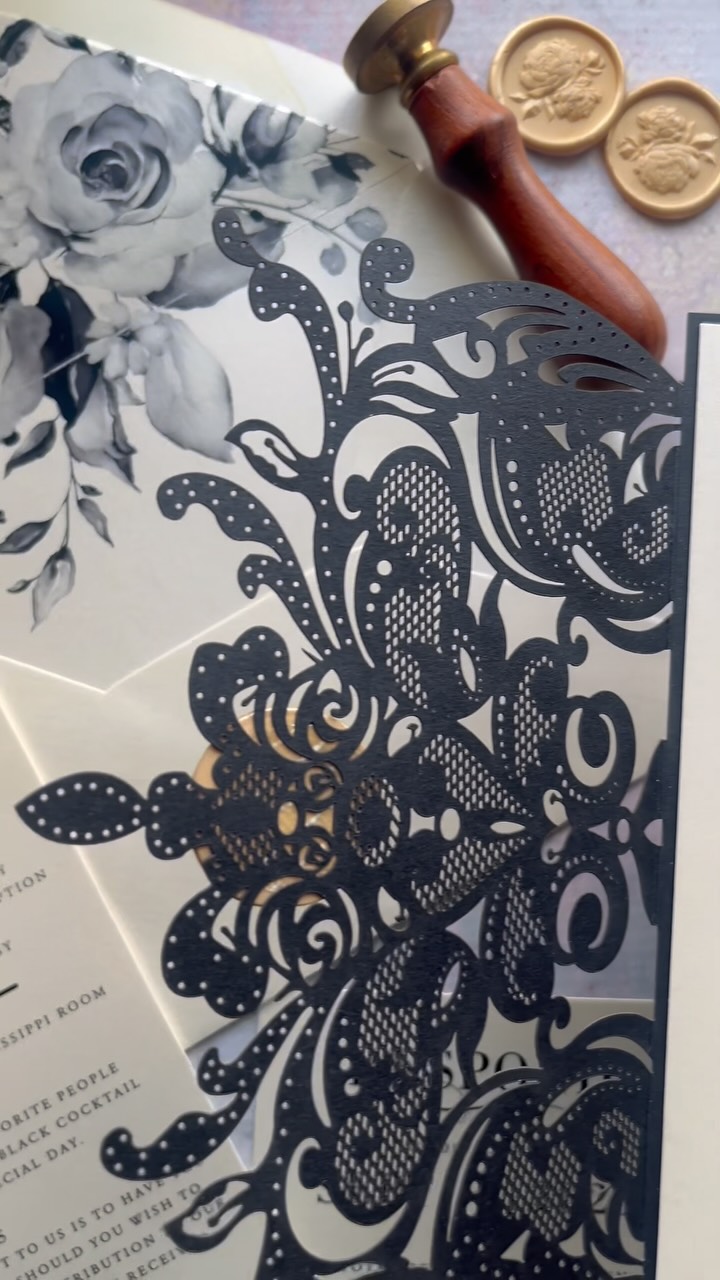 A wedding invitation suite made for the most elegant celebrations. This design features a black sparkle king lace laser cut gatefold, paired with luxurious ivory shimmer stock. Inside, the crisp black modern layout sets the tone for timeless sophistication, while black and ivory floral envelope liners add a touch of drama. Finished with golden wax seals, this suite is pure posh perfection for a black tie affair.
#luxuryweddinginvitations #blacktiebride #blacktieinspiration #weddingstationery #customweddinginvitations #luxuryweddingdetails #laserinvitation #ivoryandblackwedding #weddinginspiration #stationerydesigner #weddingstyle #bridetobe2025 #luxuryweddingstyle #waxsealinvitation #heirloomstationery