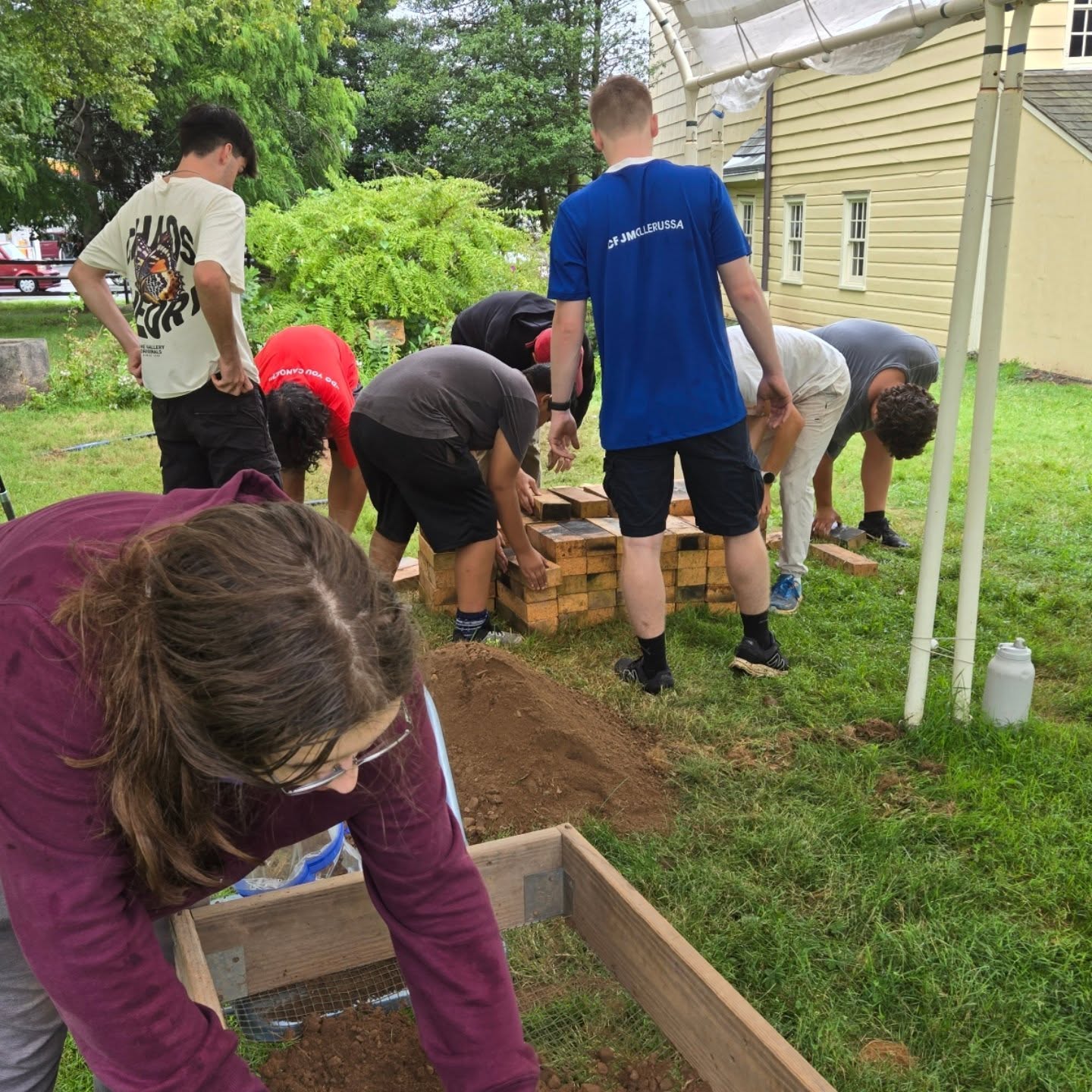 We have a future Eagle Scout working on his Eagle Scout Service Project today in the tavern yard! They are building an outdoor firepit for our hearth cooking demonstration programs! We will soon have a permanent outdoor cooking space! Be sure to visit us Sunday, October 19th for Four Centuries in a Weekend event to see it in action!