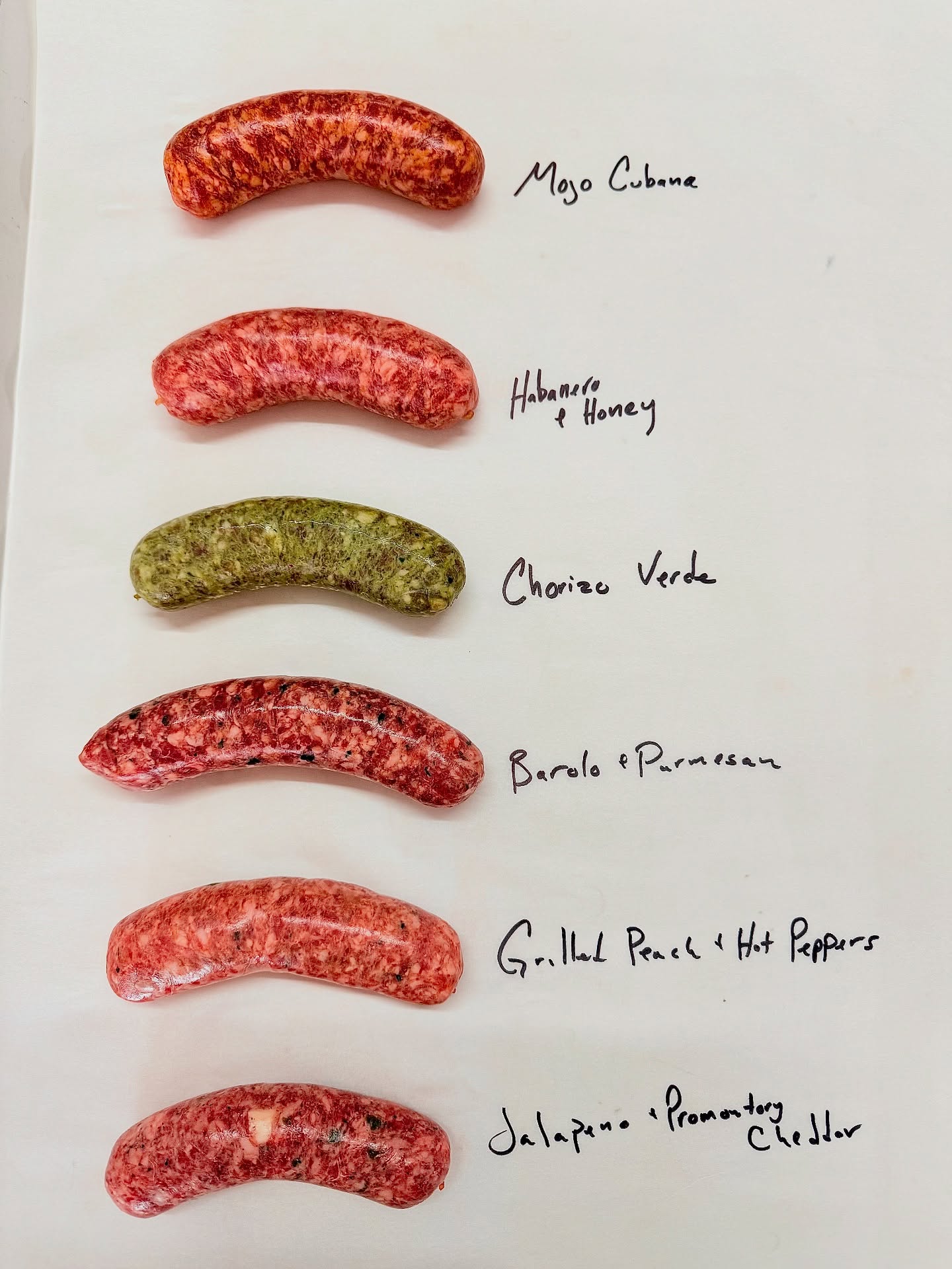 Here’s a glimpse of what we’ve been working on this week in our little sausage facility. This week’s lineup we went a little pepper heavy, but it’s hard not to when the markets are popping off right now. We also brought back two classics with a new twist on one of them.
• Mojo Cubana – a citrusy pork sausage with a touch of smokiness, garlicky and toasty spice blend
• Utah Honey & Habanero – sweet heat with local honey and fiery habaneros🔥
• Chorizo Verde – made with toasted spices, more herbs than you can imagine, lime, and fresh garlic
• Barolo & Aged Parmesan – an Italian-style sausage with deep red wine flavor and sharp Parmesan finished with parsley and fennel
• Grilled Utah Peaches & Hot Peppers – featuring farm-fresh peaches balanced with habanero, serrano, and jalapeños 🔥
• Jalapeño & Cheddar – packed with Promontory white cheddar for a rich, sharp bite. A much improved version of a classic thanks to @beehivecheese
Find us Saturday at Pioneer Park (8–2) and Sunday at Wheeler Farm (9–1). Come see us