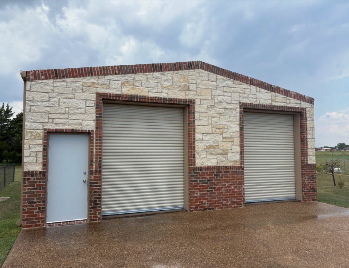 Brick and stone installed on this metal shop in Red Oak, Tx. Turnkey project.