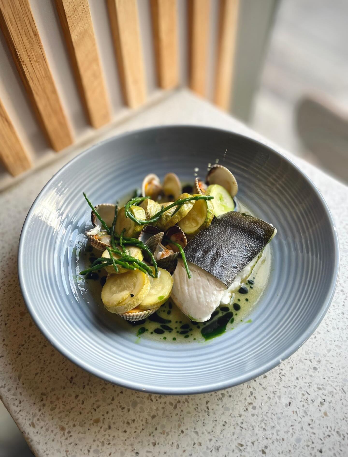 Steamed halibut, cockles, courgette, samphire