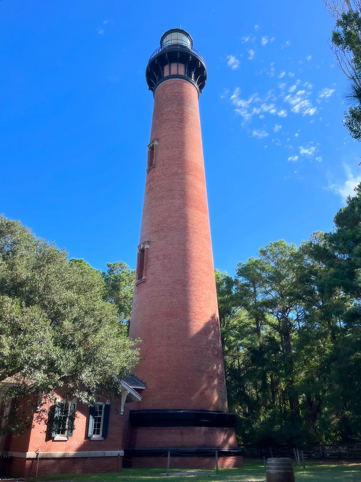 Lost in the charm of Corolla Lighthouse 🗺️✨ Standing tall against the sea breeze, it feels like a postcard from another time. 🌊🌅 #OuterBanksMagic #CorollaLighthouse #Wanderlust #SeasideEscape #TravelInspo