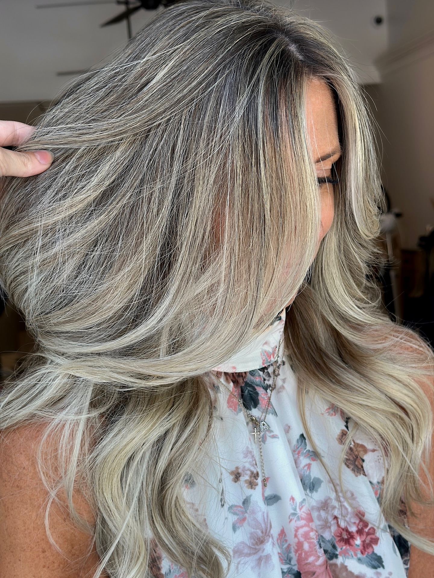 HAVE YOU EVER WONDEREDโฆโฃ
โฃ
What it would look like if you stopped trying to fight your gray and instead made them look like they were just part of your highlights?โฃ
โฃ
๐๐ฟ๐ฎ๐ ๐ฏ๐น๐ฒ๐ป๐ฑ๐ถ๐ป๐ด is an incredible option for those who are sick of harsh grow-outs that cover for two weeks and then end up making your grays look WORSE, and/or roots that go brassy as the color fades!โฃ
โฃ
โฃ
If you are just starting to have scattered gray:โฃ
โฃ
๐๐น๐ผ๐ป๐ฑ๐ฒ๐: Start stepping away from the ombrรฉ/balayage/lived in/rooted look ๐ด๐ญ๐ช๐จ๐ฉ๐ต๐ญ๐บ and start sprinkling tiny highlights throughout. We can still have a transition to bright ends, but breaking up your root with baby highlights will take you far!!โฃ
โฃ
๐๐ฟ๐๐ป๐ฒ๐๐๐ฒ๐: Donโt be tempted to covor your grays with opaque permanent color (which is what is typically done). That is a recipe for brassy fade-out and a harsh regrowth that makes your grays stand out ๐บ๐ผ๐ฟ๐ฒ. Instead, โcamouflageโ your grays by staining them darker with a demi permanent color. This isnโt as harsh and opaque and will grow out much softerโฃ
โฃ
If yourโre already pretty darn gray: โฃ
โฃ
๐๐น๐ผ๐ป๐ฑ๐ฒ๐: Stop doing permanent base colors in between your highlights and opt for highlights and lowlights instead OR a demi permanent color between your highlights to soften gray but not totally cover them. Both of these alternatives avoid the harsh line and the brassiness.โฃ
โฃ
๐๐ฟ๐๐ป๐ฒ๐๐๐ฒ๐: If you love being dark but have a lot of gray, it might be time to embrace the idea of being lighter. As we age, lighter hair tends to be more flattering anyway (even if we are used to being dark our whole life) as dark hair can sometimes emphasize shadows and wrinkles ๐ I donโt mean you have to be blonde, but adding in some dimensional subtle highlights and switching to a less opaque brunette color could do wonders!โฃ
โฃ
Itโs important to manage expectations with gray blending. You WILL still see gray. They wonโt be gone, but theyโll be camouflaged and much more enjoyable to live with without the maintenance and downfalls that come with trying to cover them!โฃ
โฃ
* Here we did baby highlights to blend a few grays, and one row of extensions to enhance her natural volume๐ซถ๐ป