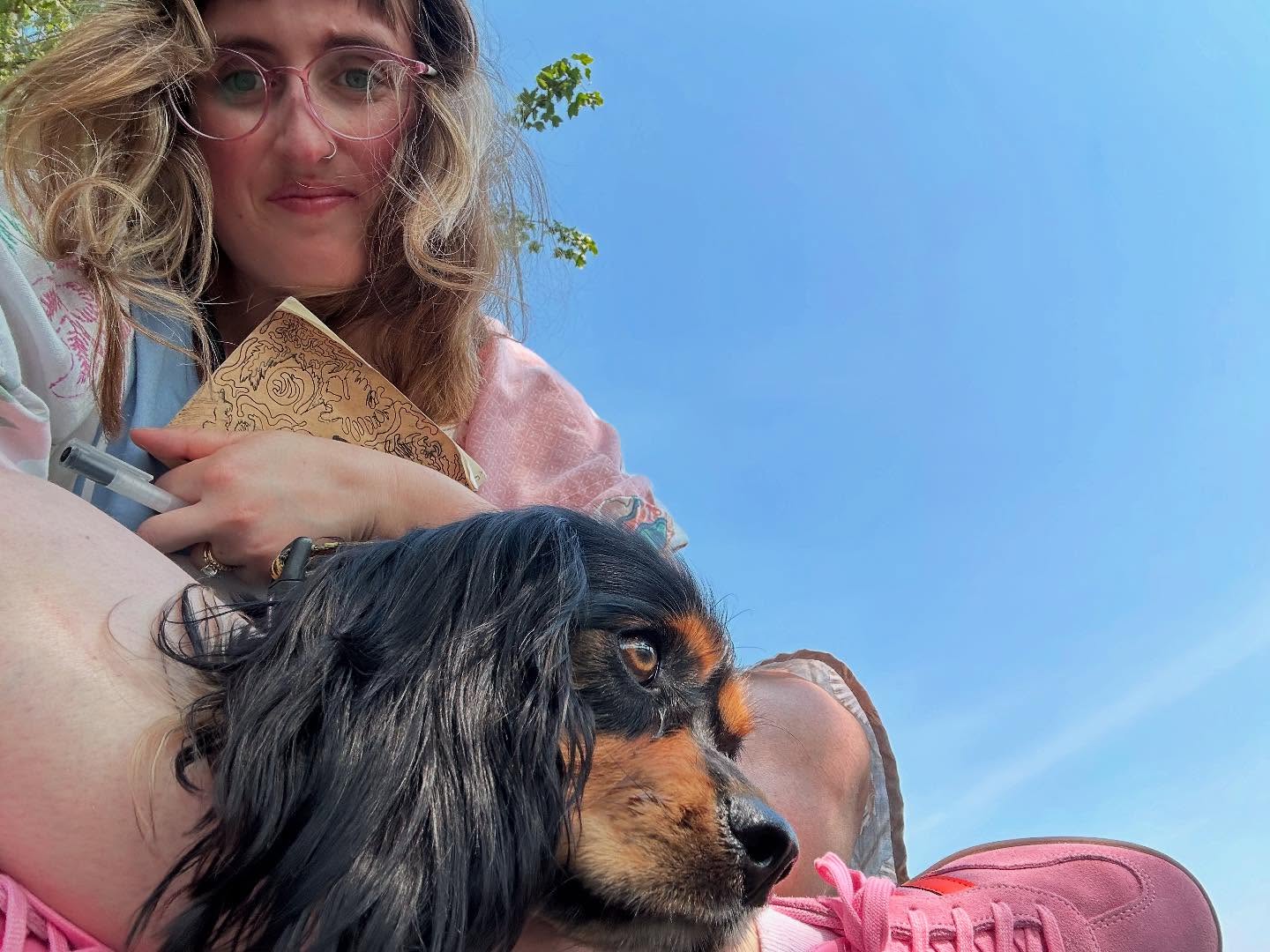 I named Poe after poetry, poem, poet. I dreamed of having a cuddly adventure dog who loved going on long walks and stopping at benches when I write poems (I usually write my poems while walking or between swimming). I wanted a little dog who always wanted to sit next to me on the couch as I read or worked, who wanted to take the aquabus to the beach, and share berries with me. A dog who would sneak into the bed while I’m sleeping and curl against me. I wanted a little dog who was fun, playful, and whose favorite spot is my lap. I dreamed of a dog who loved going to lakes, cafes, festivals, even parades. The sort of dog who sleeps on planes and loves small children. Poe is completely and uniquely his own little being, but he is also the embodiment of so many dreams I’ve had for a companion, and today as I wrote poetry on the seawall, him snuggled onto my lap (unprompted) I felt so grateful. Training and caring for Poe is so huge part of cultivating my dream life for myself, he’s truly the best little Poe(m).