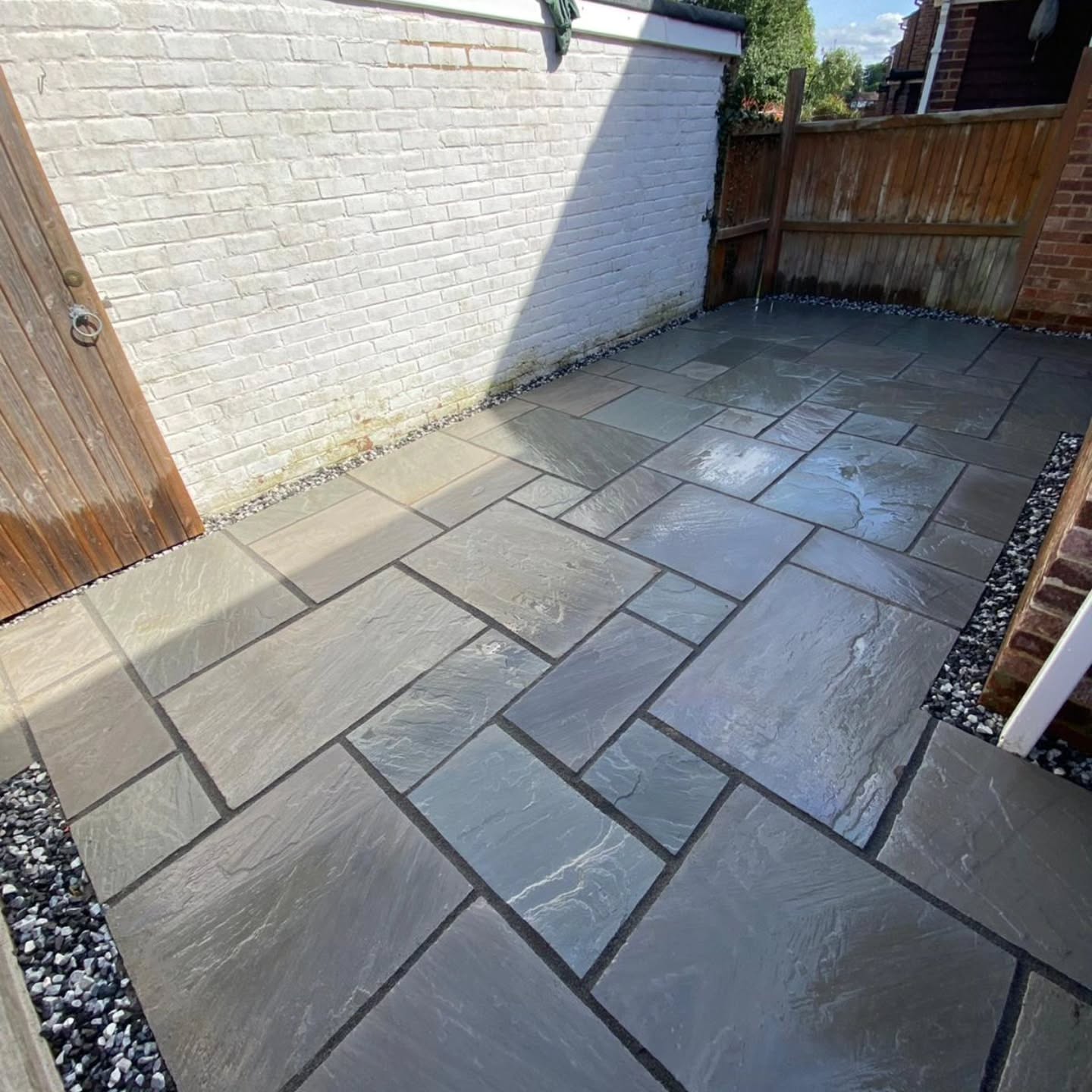 A tricky one to photograph. A courtyard that needed a tidy up. Lovely grey sandstone laid in Chilham, Kent. Great job by the team. Great results!