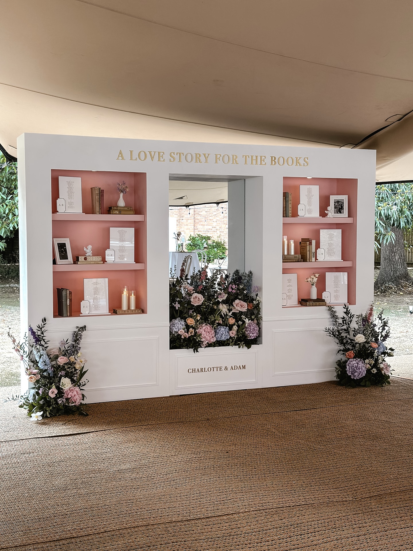 A Love Story - For OUR Books ~
Charlotte and Adam booked us for their beautiful wedding day over 12 months before they said their ‘I do’s’.
We clicked instantly and they put full creative freedom and trust in me to bring her visions to life. After our initial call - I pulled together concept sketches, which they loved - not actually knowing how we were even going to pull it off.
We kept in touch briefly over the course of the 12 months, but Charlotte showed that much trust in us that if we didnt speak much - it wasnt a problem.
When we did catch up - we spoke about our love for a good mug, she sent words of love and kindness when we had tough times, she hyped us up when we hit new milestones - and never once doubted us.
When their big day approached - the realisation of the size of this build hit us - not only were we unbelievably excited to see it come together but the overwhelm of making it, fitting it and it being perfect was a lot.
We worked endlessly behind the scenes testing how to get 5 separate parts to fit together and look like one - how to keep the soft elegance of it in such a huge, heavy piece - the logistics of the travel and set up and getting the styling just right. We spent hours sourcing vintage books, small details to complement the style and picking just the right shade of pink for the alcoved shelves.
During this time, me and Charlotte barely spoke about the actual build and just sent check-in messages to each other to see if we were ok.
This love story, is like no other. The couple. The build. The day. The relationship formed. The team. Unforgettable.
I adored this build not only because it turned out better than we ever imagined, but because of how I remember feeling and how Charlotte and Adam felt - that is one for the books.
@charl_cox
@stanbrookabbey.hotel
@etiquetteeventhire
@georgina.rose.events
@mbweddings_events
@laurenameliaphoto
@mattjonesfilms
@platinumaceevents
@perfectcakesco
@thefunctionband
@assemble_stretch_tents
@houseoffurncollection
#weddingsignage #weddingsign #bespokewedding #weddingseatingplan #weddingtableplan #weddingseatingchart #weddingstationery
