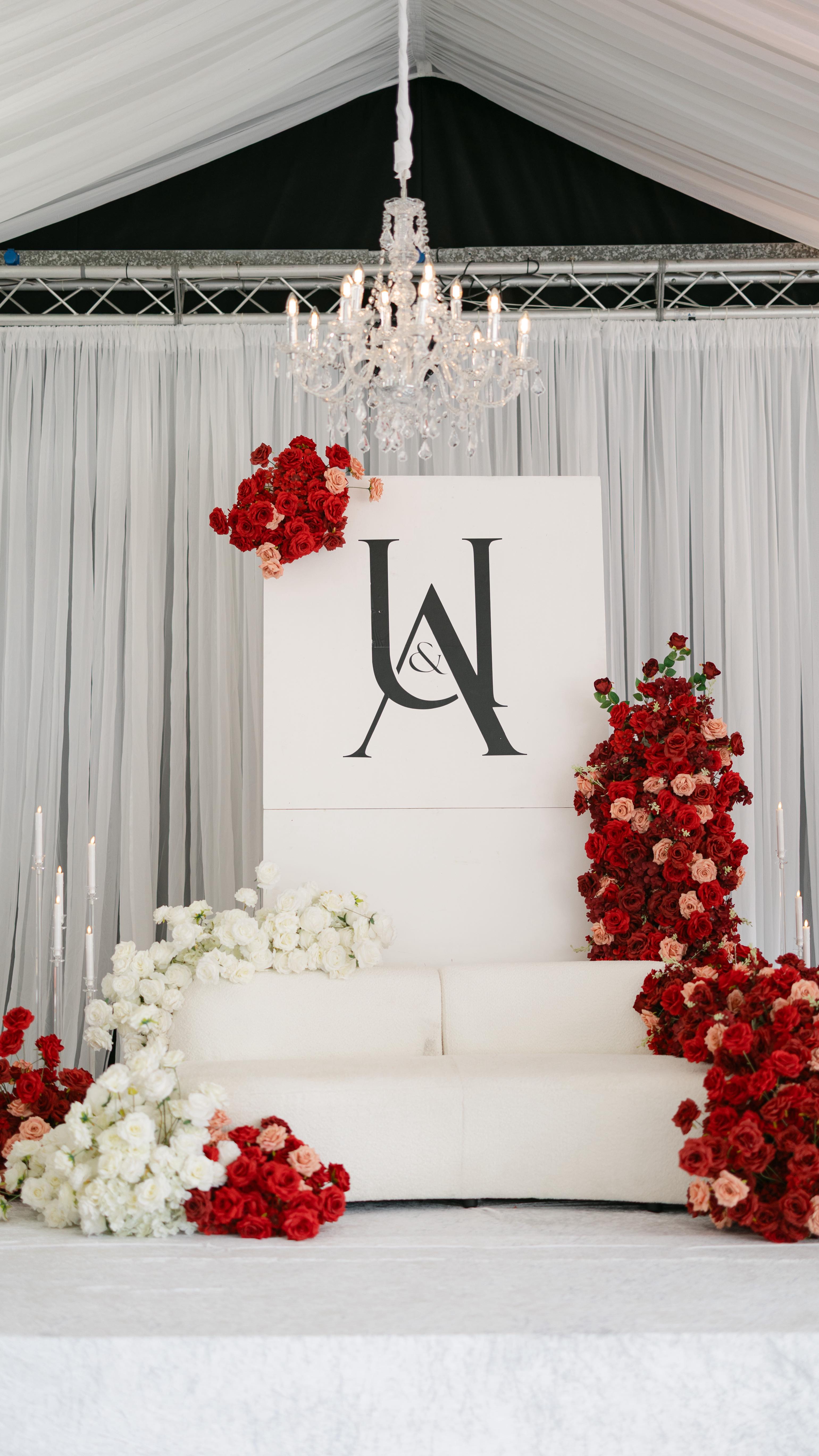 A waterfall of red and white florals cascading from the sofa – Dramatic yet refined stage decor at Braxted Park❤️
______
Decor: @cloudsixtyevents
Content Creator: @puremomentsbya
Dancefloor: @arya.eventsuk
Photography: @iamseyii
Venue: @braxtedparkweddings
_______
#cloudsixtyevents #weddingdecor #weddingstage #braxtedparkwedding #weddinginspiration #luxurywedding #weddingdetails #ukwedding #essexwedding #weddingflorals