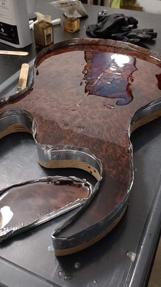 Building the Monster 8-string, part 2. The redwood burl top was fairly soft, so I decided to try and "reinforce" that with some epoxy. Granted, this wasn't a "penetrating" epoxy, but it was all I had on hand at the time and figured it wouldn't hurt to try and see if it helps strengthen the top even a little.
#ipguitars #guitarbuilder #luthier #8string #customguitar #eurocustomguitar #epoxyresin