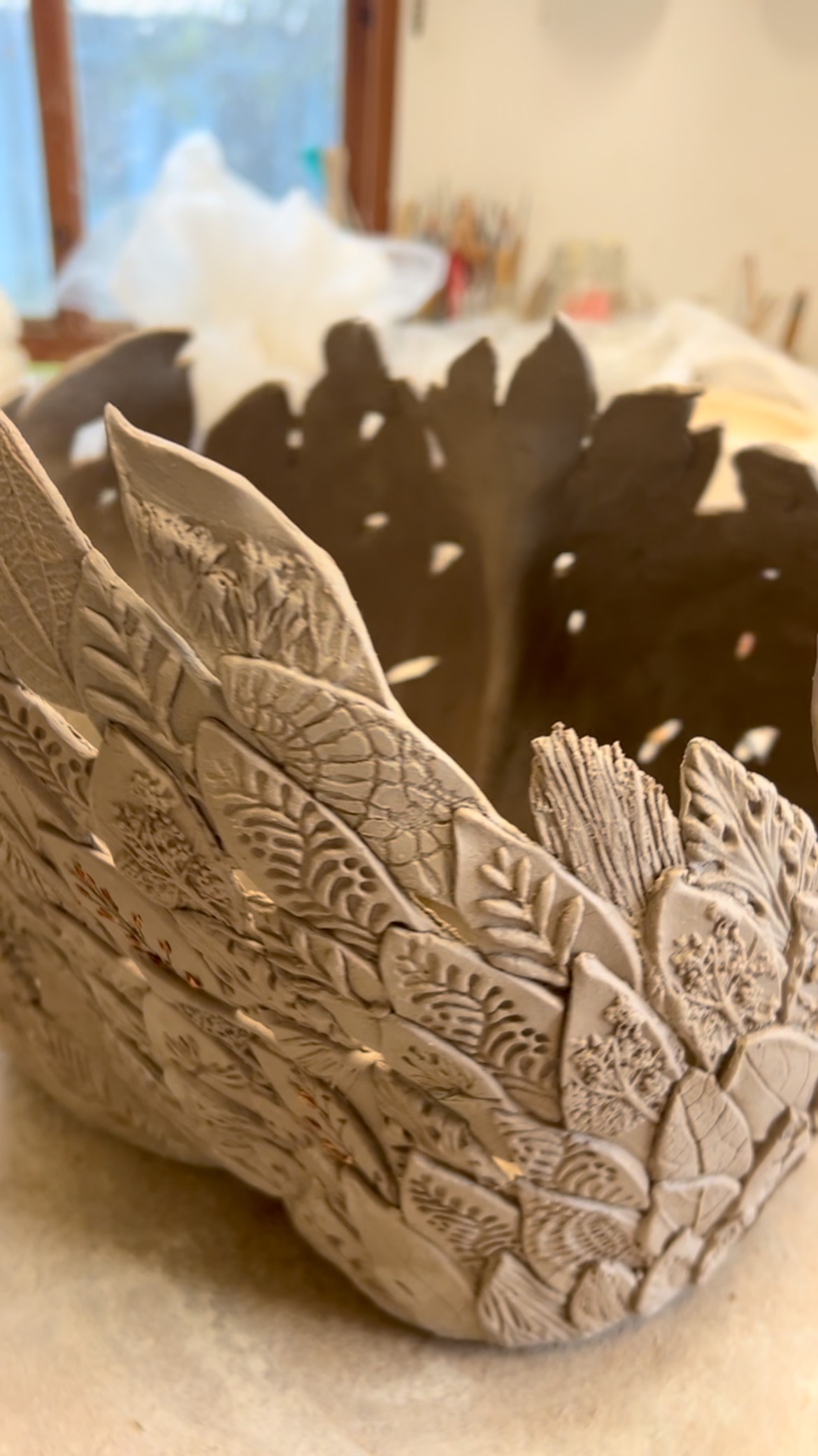 Yesterday I was #potterystudio #ceramicsofinstagram on day six of working on this sculptural clay piece. As you can see, it’s very fiddly. I make each leaf and then add each leaf with its detail and impressions, and build up, leaf by leaf. It is a slow but I absolutely love the whole process. The form begins to slowly grow little by little and it feels like a miracle is happening in my studio… strangely I don’t really feel responsible for it, in a way. I just feel part of the journey. It’s enjoyable therapeutic being a maker is a privilege I’m so grateful for. #sculptureartwork #ceramics #claysculpt #claycreations #ceramicstudio