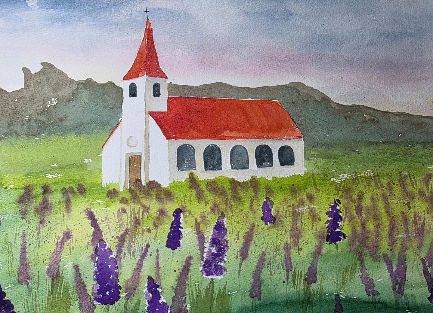 I don't know if I'll ever stop painting Iceland 😍 this is the beautiful little church in Vík. Love the contrast of the red roof and purple lupine flowers. #watercolour #iceland #flowers