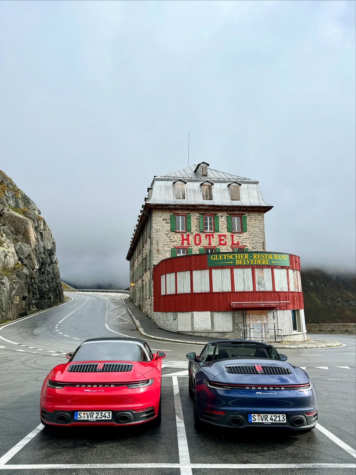 On the edge of the Furka Pass, two Porsches stand still before the legendary Hotel Belvรฉdรจre โ where timeless engineering meets timeless landscapes. This is not just a road trip, itโs Exclusive Experiences. #ExcExp #PorscheDrive #RoadTrip #FurkaPass