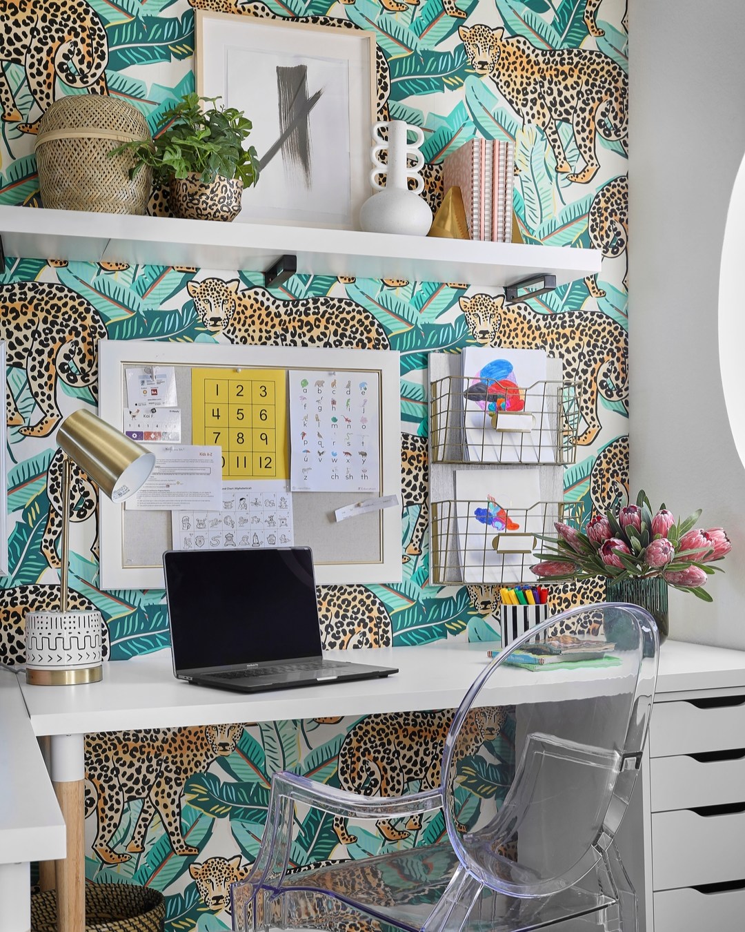 School might be out, but a great desk is always in session. 📝✨
This spot is equal parts playful and practical — with bold cheetah-and-palm wallpaper bringing the fun, and crisp white shelves keeping things tidy. An acrylic chair adds a modern touch, perfect for everything from homework to creative play.
Because even the smallest spaces deserve style and purpose.