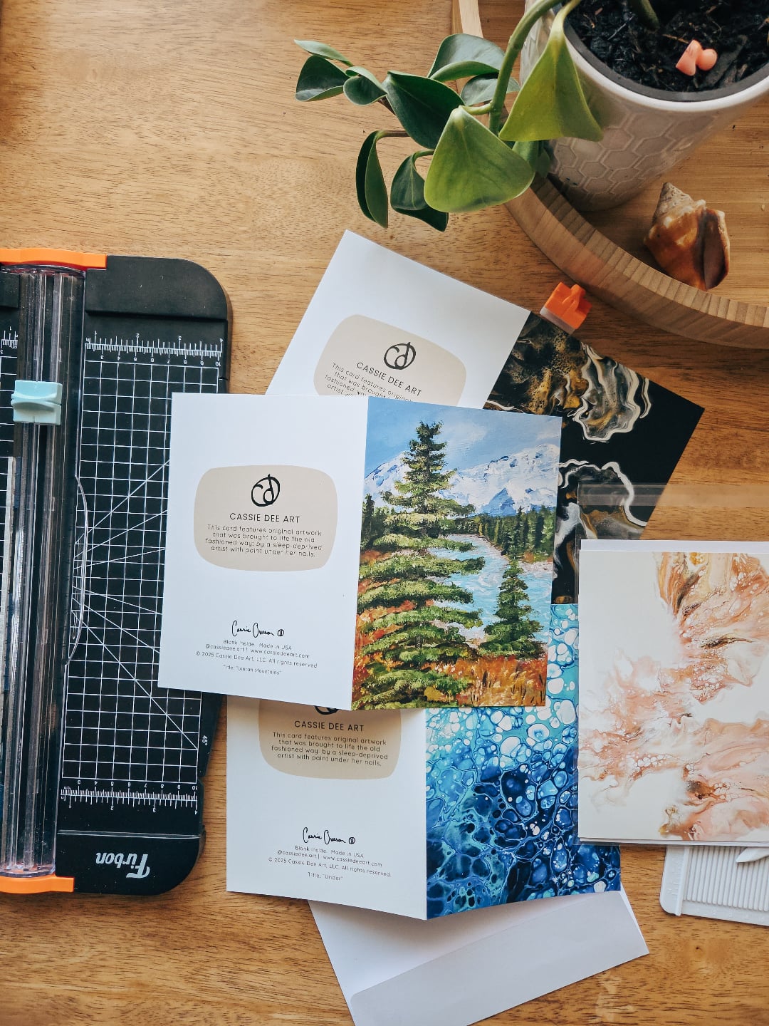 Do you keep cards as mementos, or are you more of a read-and-toss kind of person? 💌
I spent tonight folding and stuffing greeting cards so they’re ready for tomorrow’s art festival, and I just have to say THANK YOU.
Because of all your support this month, I was able to expand production from just 5 designs to all 12 — something I didn’t think I’d pull off this soon!
These cards have quickly become one of my favorite additions. They’re such a sweet way to share art. You can send one to a friend and let it live on in a whole new place, or even pop it in a frame once you’re done. Either way, it makes me so happy knowing the art gets to keep traveling. ✈️
#cassiedeeart #utahartscene #utahfineart