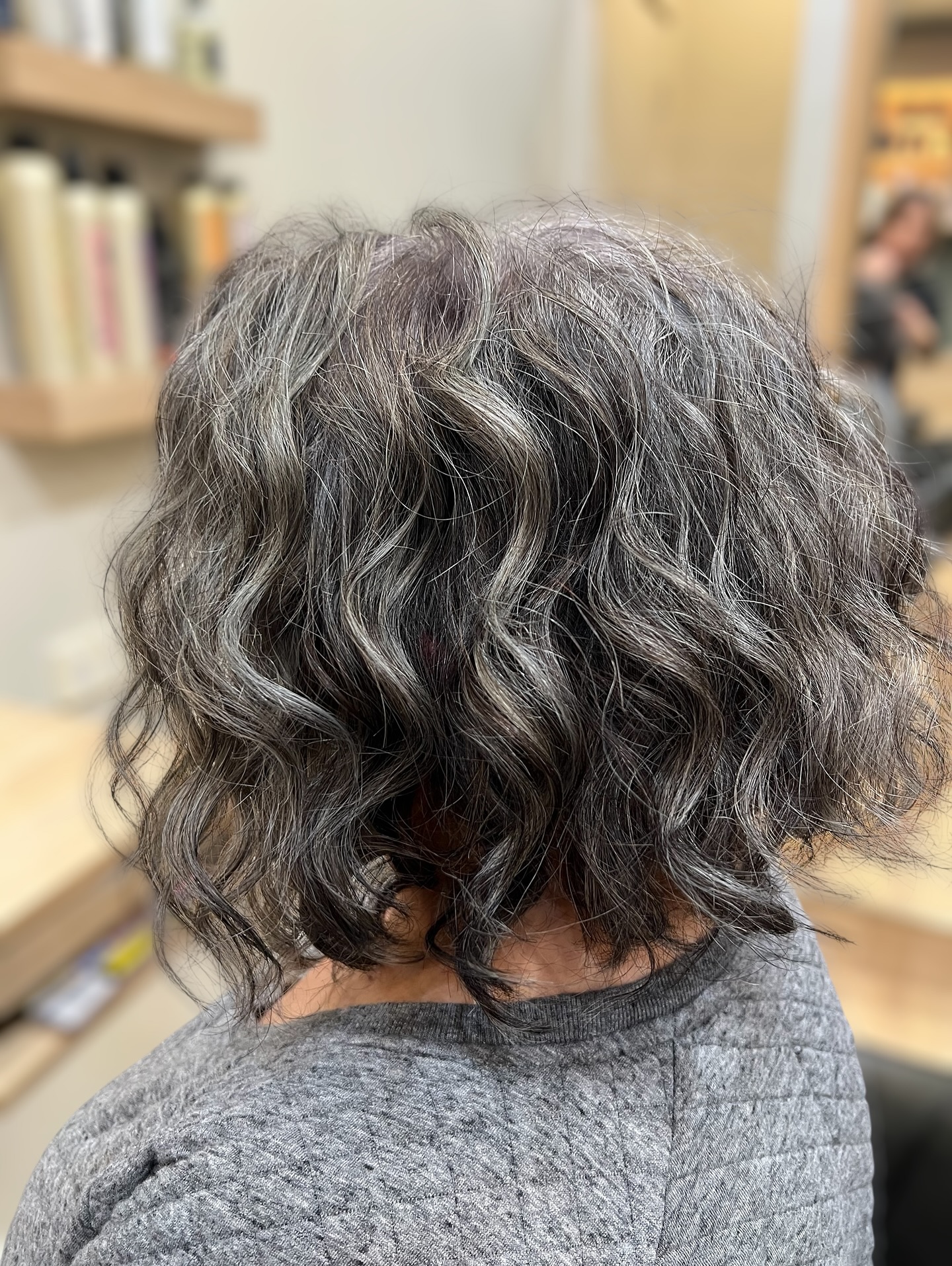 This is the beginning of a beautiful transformation. ✨
It all started with a free-hand haircut—where I believe the true magic of a style begins.
From there, we began the first step of a three-step colour transition to seamlessly blend with her strong, natural white hair. Sessions two and three will look very different, but already this is a stunning, wearable result that she can enjoy as we move step by step toward colour-free hair.
By Natalie Varrasso