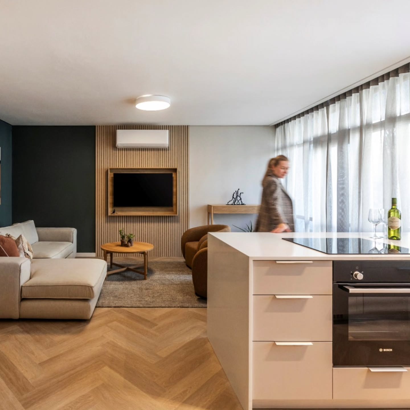 Soft light filters through sheer curtains, wrapping the room in a cozy glow, while earthy tones, wood textures, and plush seating make it the perfect place to unwind.
From cooking in the sleek kitchen to curling up on the sofa, every corner is designed for comfort and calm.
Beautiful pictures @madrabbott
.
.
#CozyLiving #WarmInteriors #ModernComfort #OpenPlanLiving #NeutralInteriors #CalmSpaces #HomeInspo #ContemporaryLiving #CozyCorner #SoftTones #InteriorGoals #DesignDetails #CozyVibes #camiinteriors