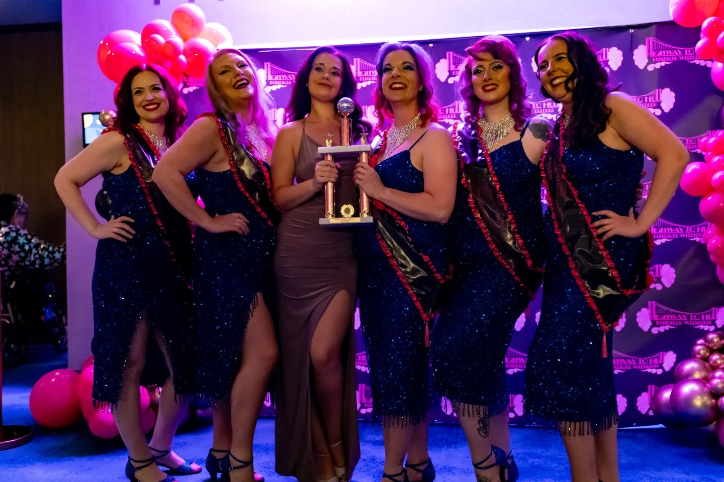 Finally back from a little jolly holly 🏖️ and straight into lovely messages from Highway to Hull! 💕 I was gutted not to stay the whole weekend (next year I will!!), but I just love events where the community comes together.
And honestly, as much as I treasure all the lovely comments, you can’t beat a compliment from a burlesque legend like Judith Stein. Before sharing some mind-blowing stories (seriously, if you ever get the chance, sit and talk to Judith Stein!!), she told me I’d restored her faith in burlesque troupes. That alone makes 9 years of troupe work worth it 🙌 I'm pretty sure she called me a $l@g and then reminisced about her Nottingham adventures, so yes, I can die happy now 😅💖
Speaking of troupes… I’ve been involved for over a decade, like most people I started in one, but next month marks 9 years of mentoring them. I’ve been lucky enough to support troupes and schools across the country, helping them merge into the industry, create troupe acts, develop class plans, and most importantly, support both students and schools in growing together. I adore running troupe workshops (always with a sprinkle of troupe history, because it’s often skipped). A lot of performers are part of troupes/collectives as they can provide a great support network, and there is nothing like dancing in your pants with like minded people.
Now I’m back on the burly grind 💃✨ getting ready for the next show on 6th September at Loftus Club, Saltburn-by-the-Sea, Private Club on the 13th Sep and of course Cosy Cabaret on 27th September at Alea Casino, Nottingham 🎭 don't forget the new Cosy Qurve on the 10th October in Peterborough 👀
Links are in my bio👆
📸 Photos by the lovely @photoniti @artistoniti
#burlesque #burlylife #burlesquecommunity #burlygrind #showgirl #cabaret #burlesqueshow #burlesquedance #burlylove #burlesqueuk #burlesqueperformer #ukburlesque #rubysdeluxe #highwaytohull