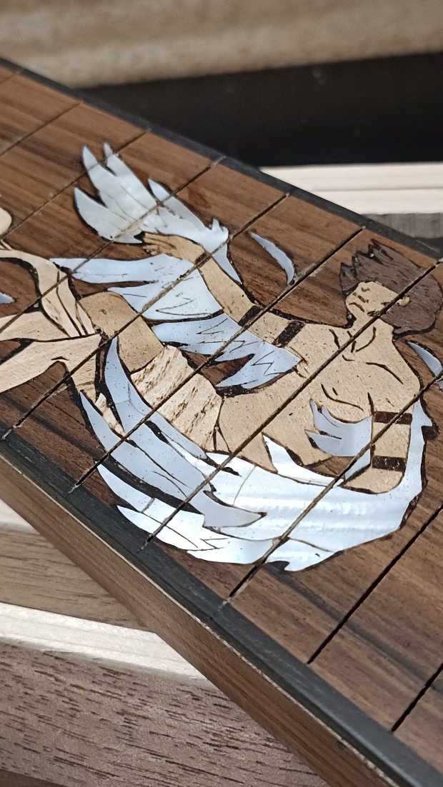 The 8-string build, Part 3.
The massive inlay process of the falling Icarus. Out of different woods, Mother of Pearl, and brass. A big effort, but one I had been waiting to do for years.
This was the best possible project for this inlay and I think it turned out pretty well.
Remember, this 8-string Baritone Icarus is still up for grabs 😉
#ipguitars #8string #customguitar #guitarinlay #guitars #handmadeguitar #inlay #baritone #extendedrange