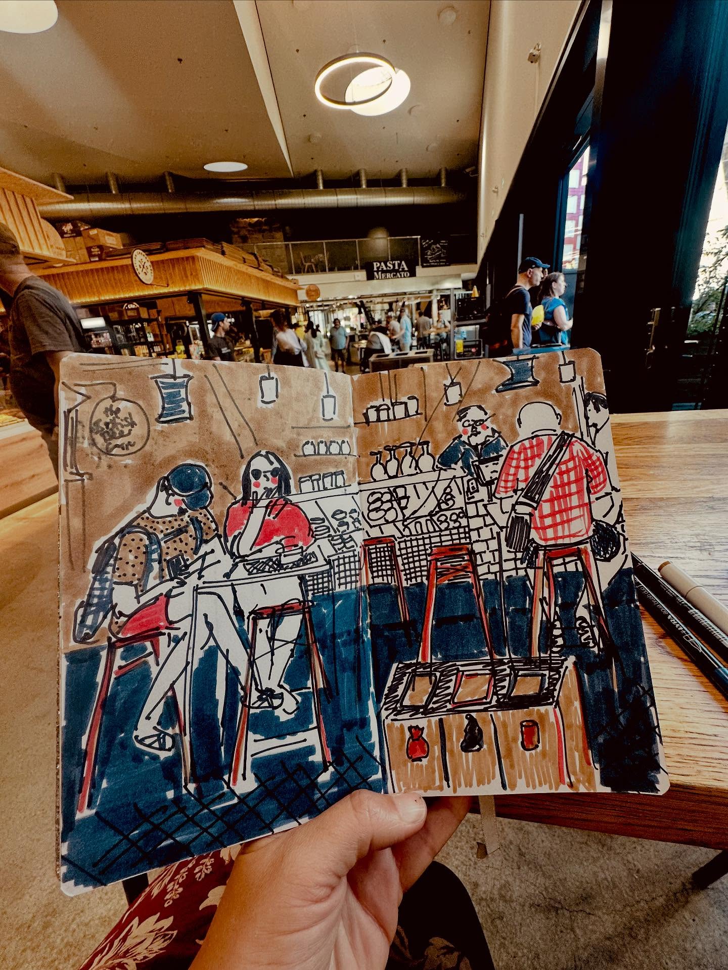 So throughout August I really enjoyed the #3materialsdrawingchallenge I felt it slightly fizzled out for me on the last couple of days as I didn’t have much time and didn’t draw anything I felt like sharing 😂 So this weekend I thought I’d try and keep it up and post a final sketch for the challenge.
Had a lovely couple of hours wandering round Viaduktstrasse, Pfingstweidstrasse and Josefwiese in Zürich yesterday whilst my daughter was in a theatre class. Managed to do a little sketching including this one in the cafe area of the Im Viadukt food market. Can’t make up my mind if I prefer the table coloured in or not. What do you think? More perspective when coloured in, something nice about the lines somehow when it isn’t.
I do love a food market, even if the swiss ones are a bit pricey so I can’t normally buy more than a little snack! This time a red bean bun which was lovely. I spent some time pining over a pack of delicious looking cheese biscuits but at 9.80chf a packet I decided to give it a miss. Cheese biscuits don’t really exist here in the normal supermarkets - it’s strange what you miss when you live abroad. Like Shreddies, who knew I would ever miss shreddies?!
This great challenge is hosted by @charlotte.durance @kathryn_boyt and @naomitippingillustrator
#goodshipillo #drawfromlife #drawfromlifeeveryday #threematerialsdrawingchallenge #drawfromobservation #drawpeople #sketchbook #sketching #3materialsdrawingchallenge2025 #weekendsketch #urbansketch #walktosee #urbansketchers #zürich #imviadukt #imviaduktzurich