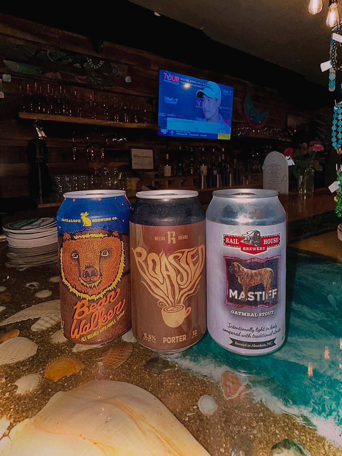 🍻 Seth’s Picks for Jharixa’s Favorite Time of Year! 🍻
As we get ready to indulge in some dark brews this fall, check out these selections that Jharixa loves:
🐻 Bearwalker Maple Brown Ale 5.1%
Infused with pure maple syrup and chocolate malts, this brew offers a sweet, roasted flavor profile inspired by our brewmaster’s Vermont roots.
☕ Raleigh Brewing’s Roasted Porter 6.5%
A rich, medium-bodied porter featuring locally roasted coffee, cocoa, and dark fruit flavors. The perfect cozy companion for cooler days!
🐾 Railhouse’s Mastiff Oatmeal Stout 6.5%
This dark stout boasts a silky mouthfeel with notes of chocolate and coffee, plus a unique nutty character from the oats.