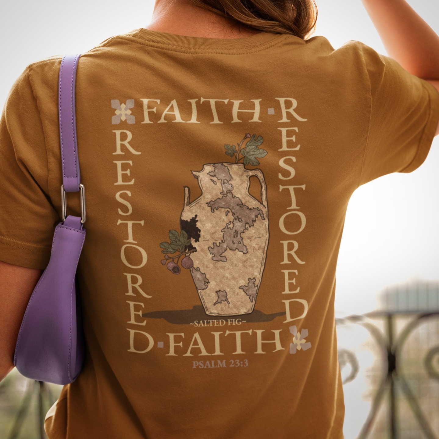 FAITH RESTORED
God offers us the gift of restoration for our souls, a gentle reminder from the Psalmist that when we are broken and feel lost, He will guide us to a restorative rest in His presence.
We designed this shirt for a declaration of this truth and is beautifully symbolized through the new growth fruit in a broken vase.
"He restores my soul. He leads me in paths of righteousness for his name’s sake." PSALM 23:3 ESV