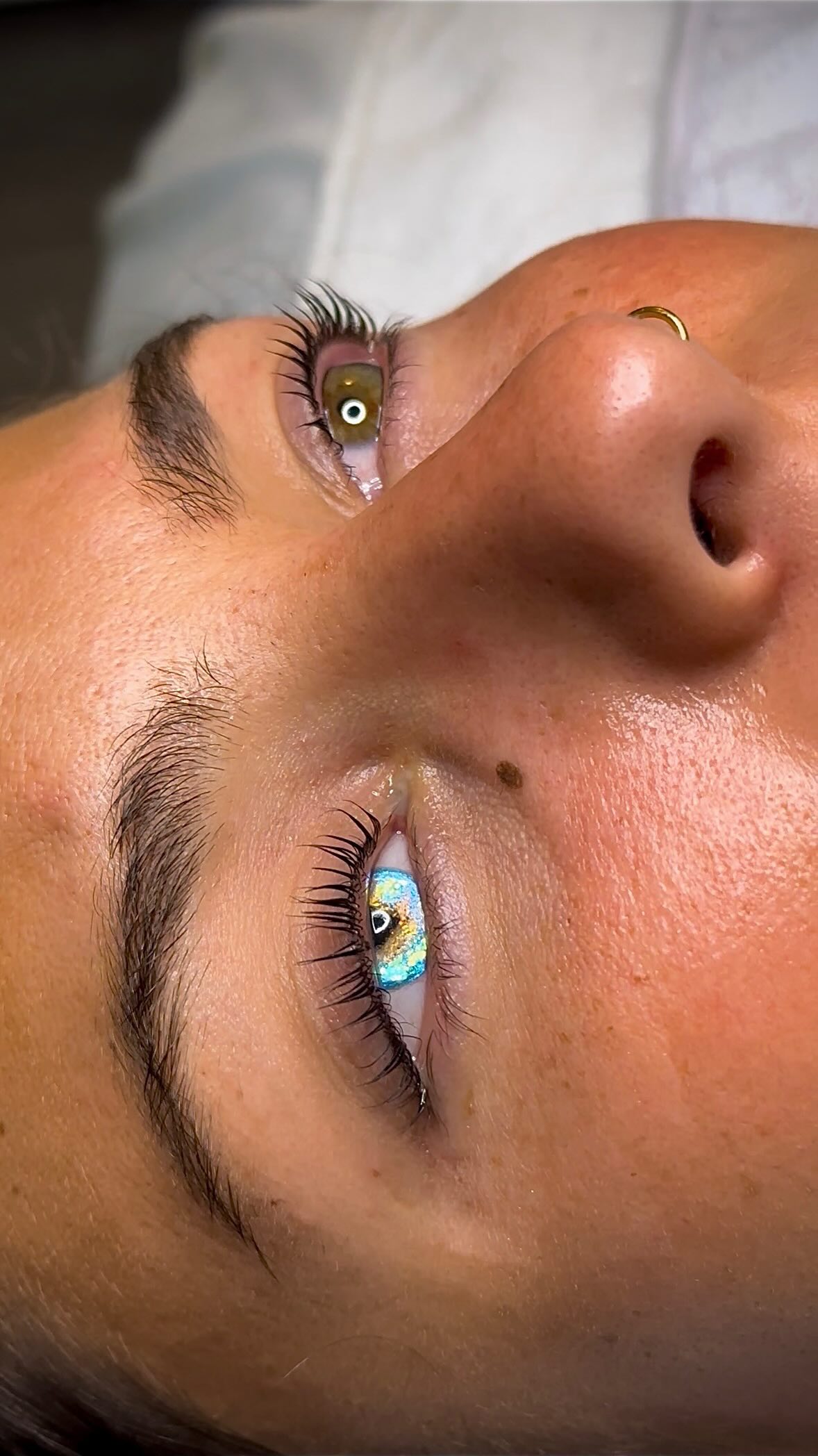 Lash lift and tint with a glowing new accessory from @centerforocularprosthetics. We are so obsessed with the way her new eye sparkles against the dark lashes.✨ #PearlEssenceBeauty