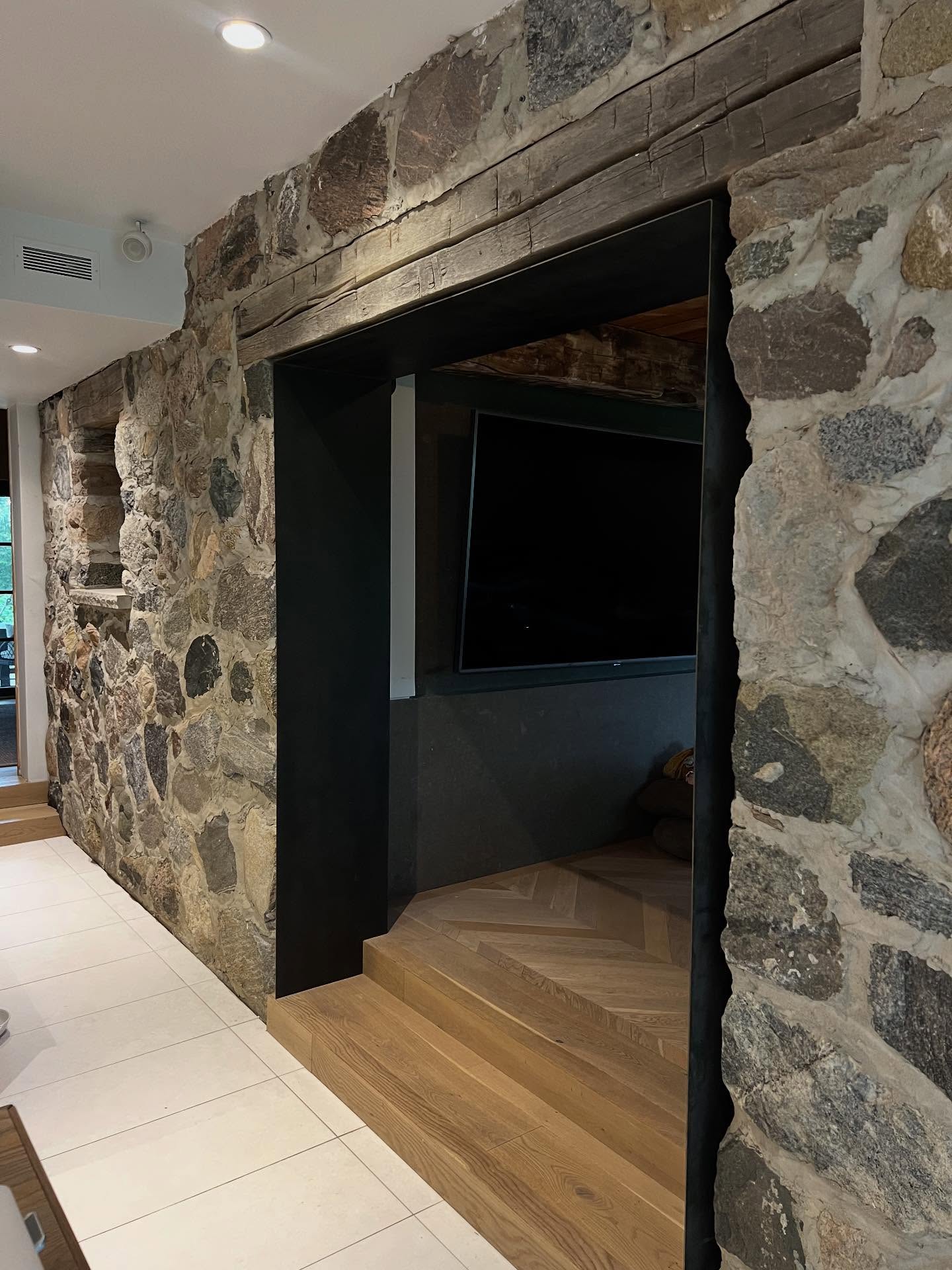 Blackened steel entrance surround. Love how this turned out next to the old stone work.