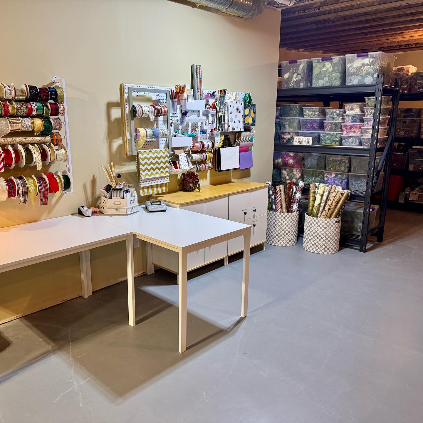 Well, you guys asked to see my basement where I store all my decor and craft supplies. After the very busy summer we had I spent the last week getting everything organized before the fall and winter holidays begin.
We have a large basement which affords me a lot of storage that I keep very organized. I am a collector or ribbons, and I love to wrap gifts elegantly, so I’ve created a wrapping station that I cannot be happier with. It’s AMAZING. The storage with all the organized floral totes is new, I’m tired of digging through totes when I want to create a floral arrangement. The florals are now organized by type, season, and colour. I also have organized all my greens into stems, garland, and fillers. Yes this took I a lot of time but I’m loving it!
Christmas tree decor are stored with the decor and tree together, I can easily just pull the trees I want to put up. No looking around or rummaging for things. They rest along a long wall in the basement, it’s not as much as people believe as I am very organized with take down.
I also have built in storage in another section of the basement for all kinds of things I need but don’t use daily. I store all my decor pillows, extra throw blankets, small seasonal decor signs, small appliances I don’t use often, vases, paper plates and cups, baskets, etc in that area.
Finally I have a table for crafting, painting, and scrapbooking. We have set up our old family room furniture and we have a tv on a stand that Eddie and I can watch while we putter away or relax with the pups while I’m crafting.
The key to all of this is organization. It’s not fancy, no ceiling, painted cement floor but it’s my little workshop and I love it.
#craftroom #holidaydecor #holidaydecorstorage #storage #flowerstagram #homestorage #craftroomdecor #organize #organizeyourlife