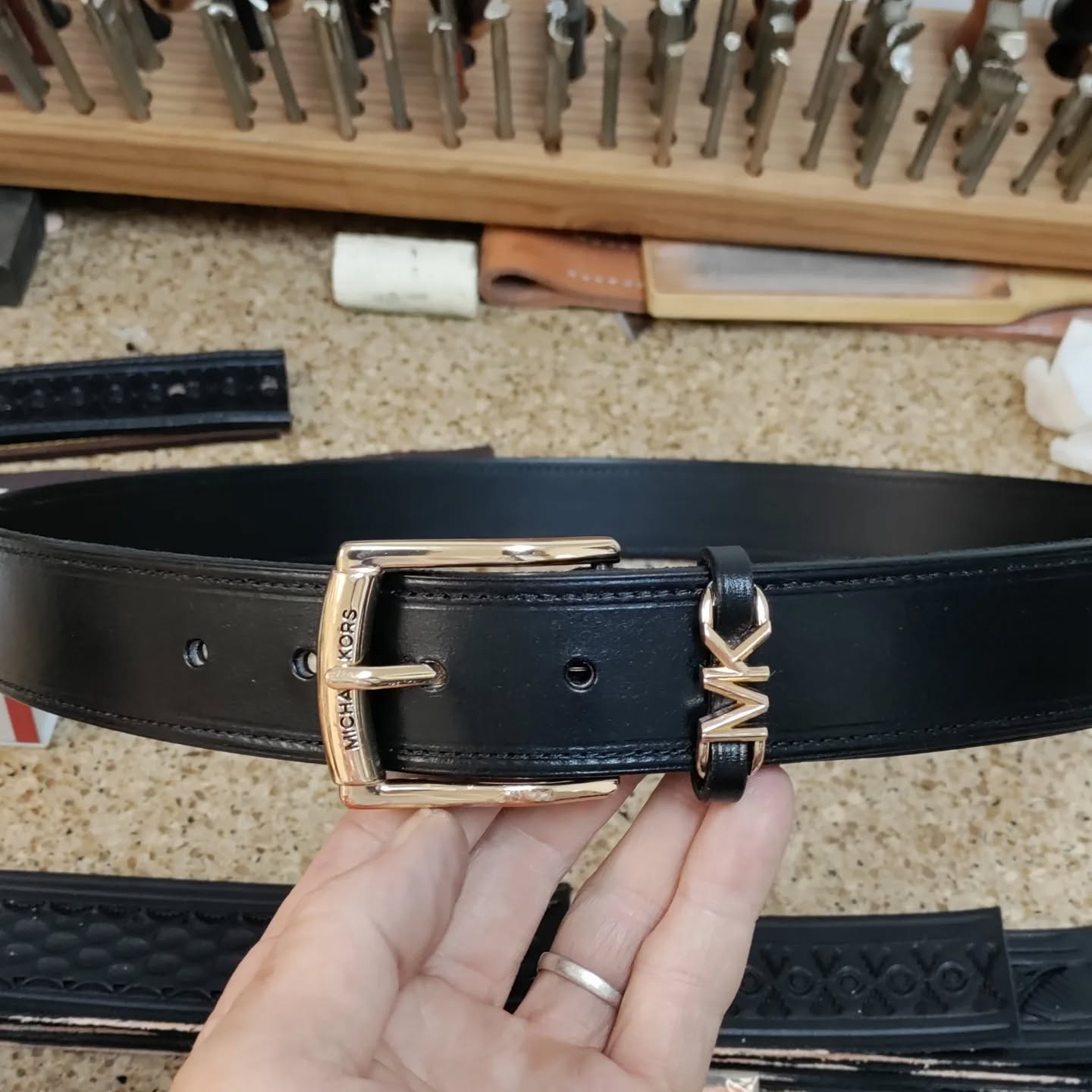 Shots of the new and old leather from her Micheal Kors belt. She wanted a smooth leather instead of pebbles grain. Hand dyed veg tan bridle leather with smooth utility lining. Original belt was thin chrome tan with filler and vinyl lining. #belt # #custombelt #leatherrepair #customleathergoods #handbags
