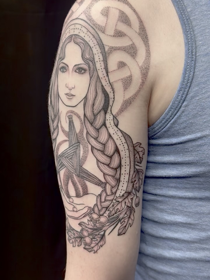 Created a tribute to the Irish goddess of light: Brigid. She is surrounded by hawthorn, snowdrops and wheat, to represent the seasons. Included is a 3-pointed Brigid’s cross surrounded by her flame.
-
Thank you to the loveliest client!
-
#triplegoddesstattoos #irishmythology #irishtattoo #brigidgoddess #dotworktattoos #botanicaltattoo #goddesstattoo #pagantattoo