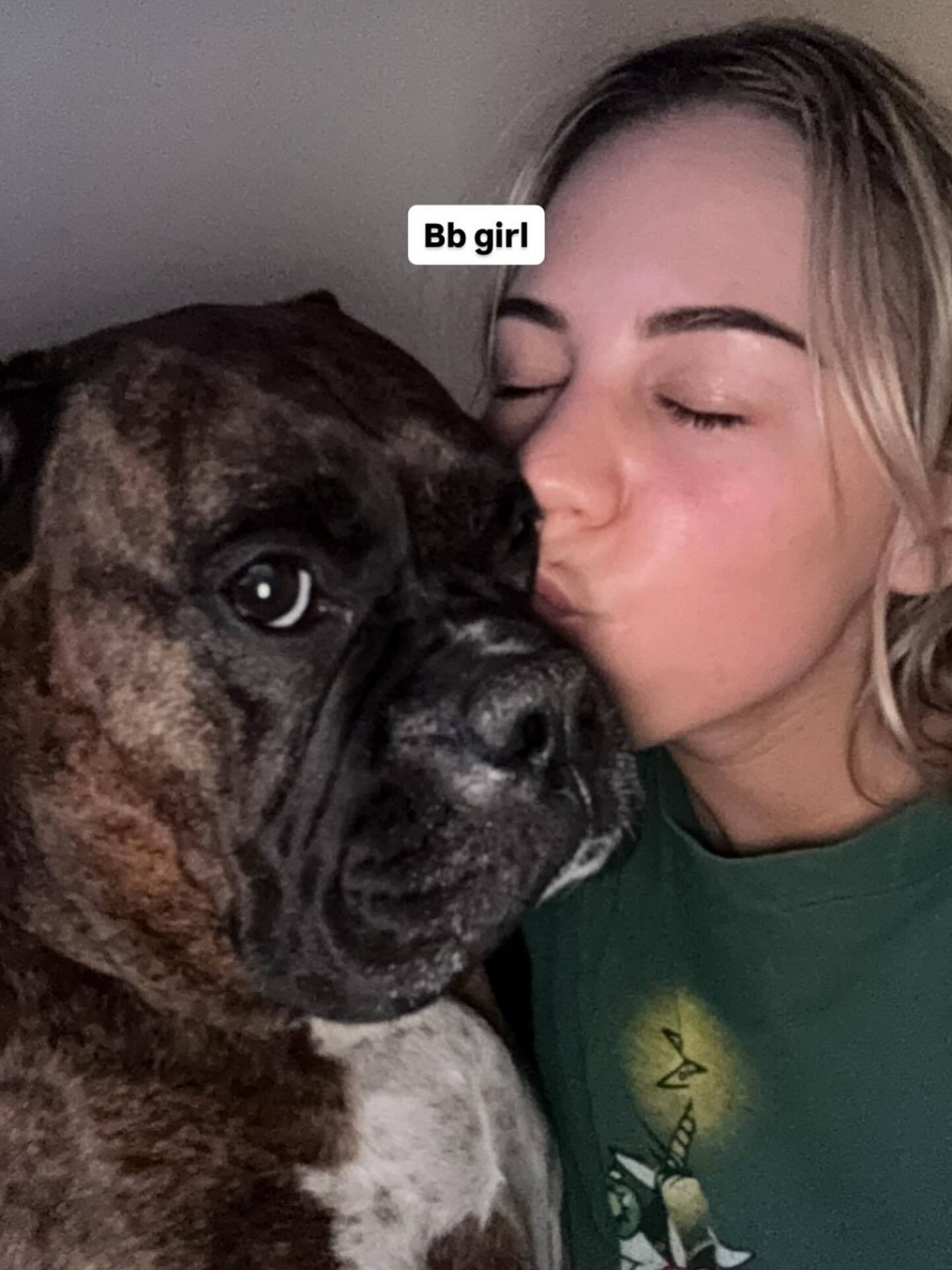 My future DIL and Oogie. Meg is the coolest. She’s so sweet & cuddly, but also crushing it in #fantasyfootball —- I love this pic so much. #boxerdog #portraitmood