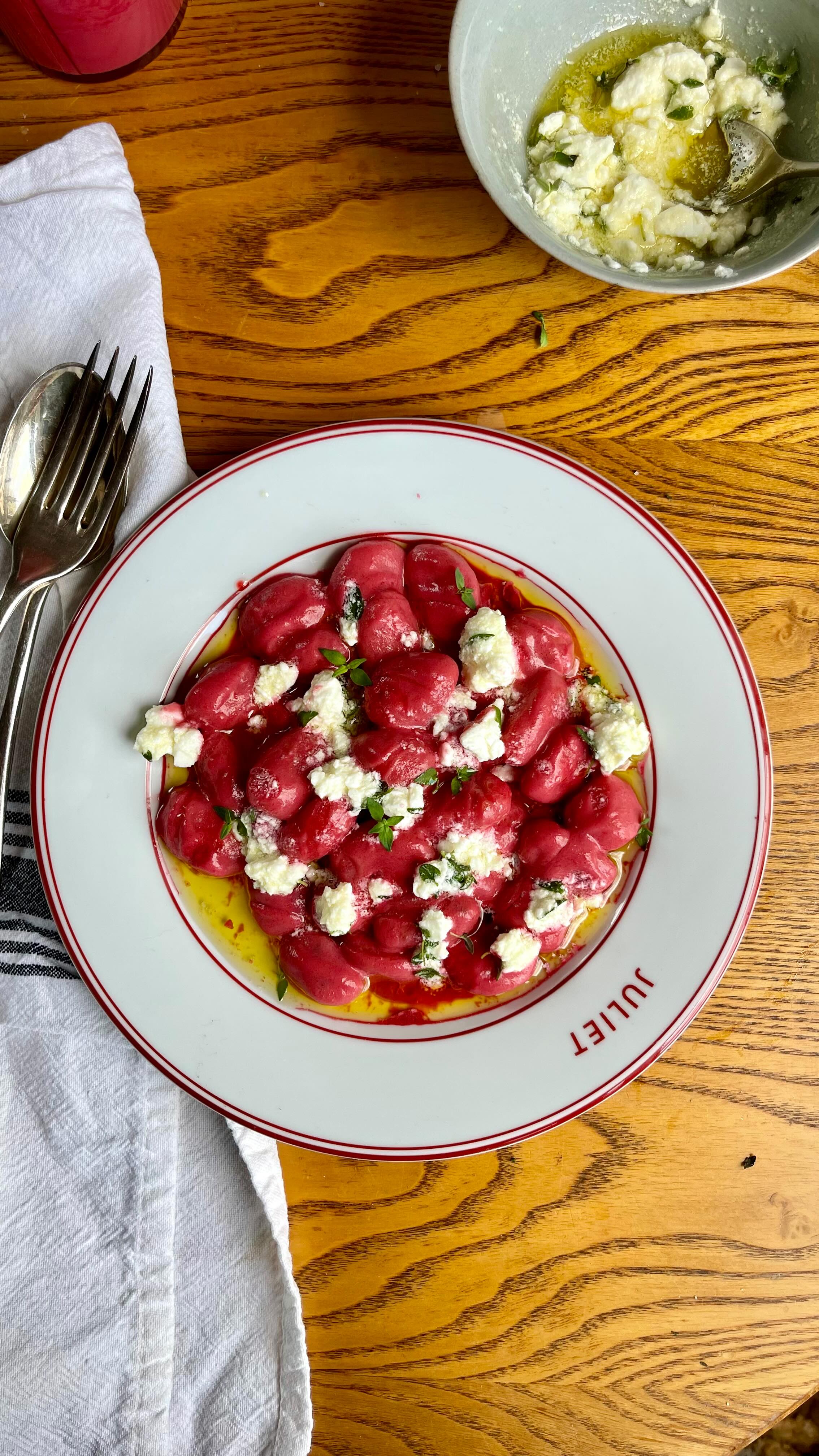 Beetroot & Feta Cauliflower Gnocchi 🩷
Autumn is fast approaching, and I am feeling more and more in the mood for those autumnal veggies. This recipe is a take on @nadiyajhussain’s beetroot pasta, and the first time I made it I was shocked by how delicious it was with so few ingredients.
Plus, the colour?!
You can buy all these ingredients, including Sunny & Luna’s Cauliflower Gnocchi (which is one of your five a day!) on Ocado.
You’ll need -
Sunny & Luna Cauliflower Gnocchi
Approx 300g cooked beetroot
150g feta (50g for the sauce, 100g for topping)
Half a lemon
1 clove garlic
2tbsp Extra Virgin Olive Oil
A few sprigs of thyme
Place the beetroot, 50g feta, the juice of half a lemon, garlic, and olive oil into a blender. Blend until smooth, taste and season. Add a splash of water if the sauce feels quite thick. Blend again briefly to combine.
Pan fry the gnocchi in a non stick pan with a little oil for 2 minutes, then add a splash of water and continue to cook for another 3 minutes until the gnocchi is crispy and golden.
In a small bowl, place the remaining feta, a good glug of olive oil, salt, pepper and thyme leaves. This is your topping.
Warm the sauce through, add the gnocchi, and plate up. Top with the feta mix and enjoy!
