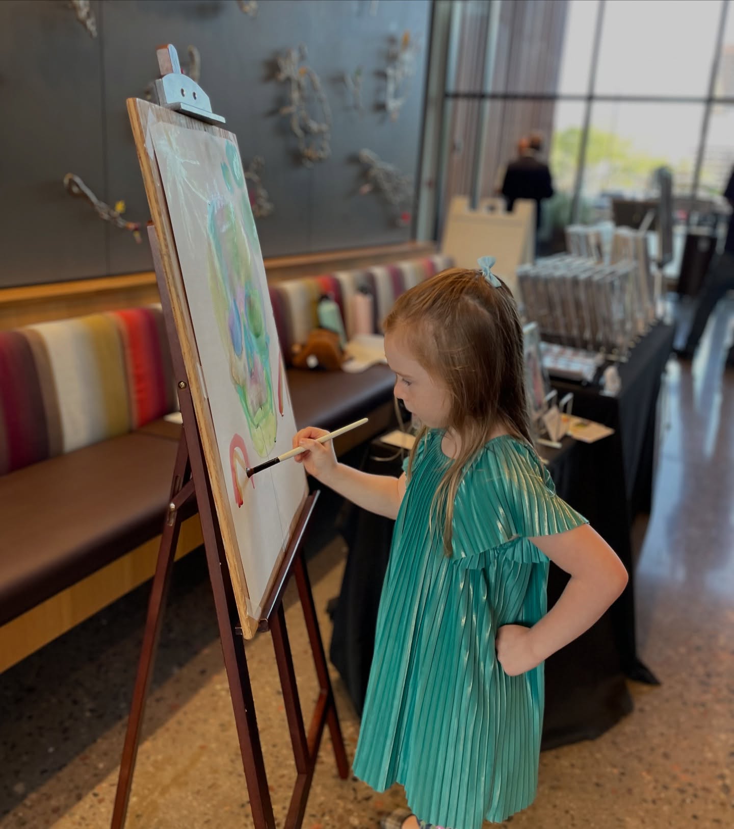 As an artist, I’m lucky to give my daughter a spot to sell her art at professional art events. I taught her how to carry a style across multiple artworks to create a
collection. She learned how to mat, display, and price her art. She creates her own business cards, sets up her own art displays, talks to customers, and helps clean up. We’ve been doing this almost a year and she’s sold almost 100 pieces of art! She’s learned about spending, saving, and investing, and has gained the kind of confidence that only comes with experience. She knows she’s capable of anything, and that means the world to me.
Now, I’m bringing these same lessons to my Little Entrepreneurs Art class! Check out my class schedule if you have a K-6th grader in the Phoenix/Tempe area.
These pictures are from last week’s art event where my 5 yr old and I painted live in our first collaborative artwork. It was so much fun and I am absolutely in love with the final result! She’s teaching me to create more freely, use brighter colors, and just have fun with the creative process. 💕
.
#homeschoolarizona #arizonaentrepreneurs #arizonaartists