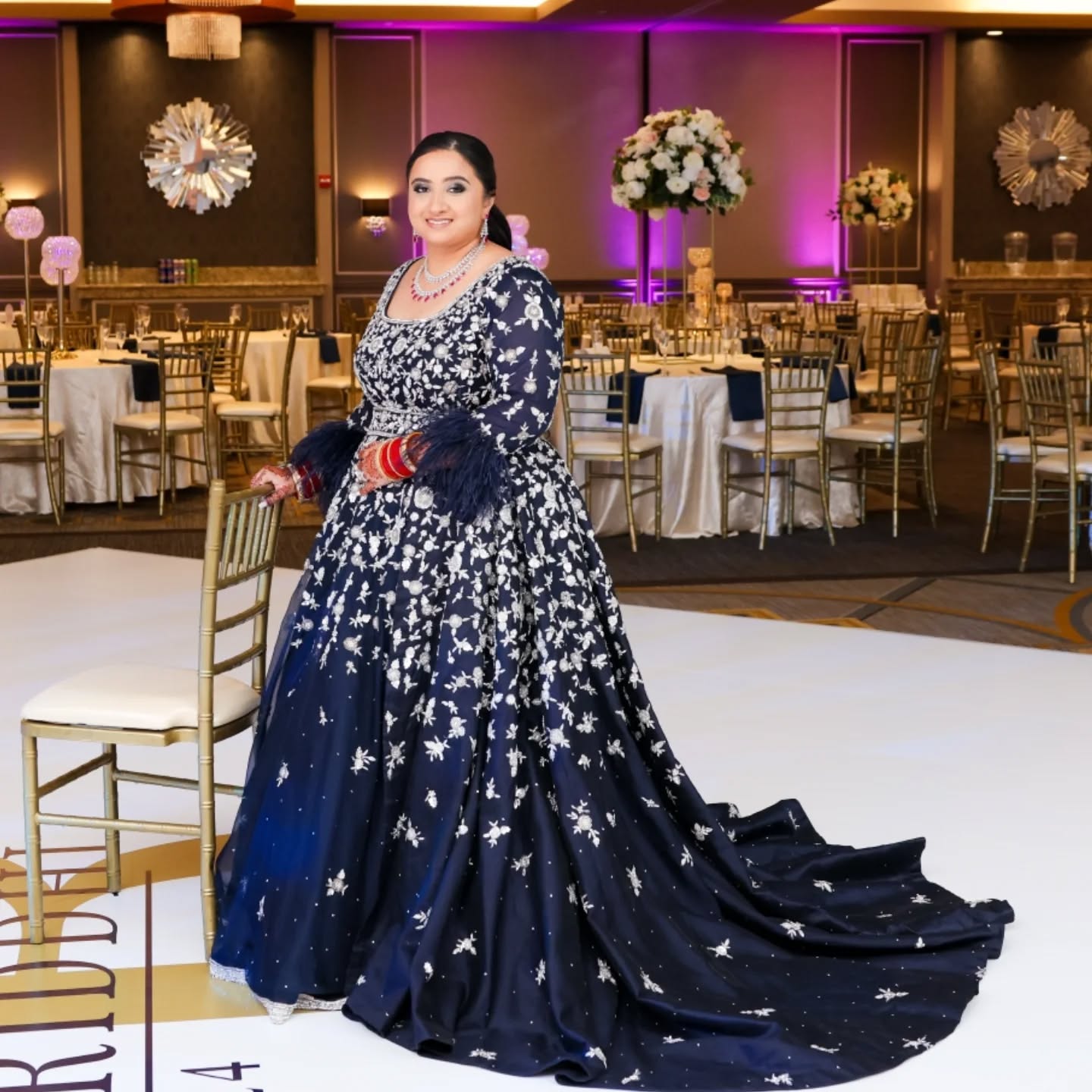 A custom midnight-blue gown with a graceful removable trail, adorned with intricate silver embroidery. The flowing silhouette carried an air of regal elegance, while the shimmering details added a chic, modern edge—an unforgettable reception look for our beautiful bride Riddhi.
Bride:@riddhipatel_goomar
Outfit:@crossoverchicago
Photography:@shanphotographyinc
Planner:@j2revents
Henna:@hennabyparvin_
To design your bridal or partywear outfit
Email:mandeep@crossoverchicago.com
#CrossoverChicago #reception #receptiongowns #bluegown💙 #indianbride #southasian #southasianbride