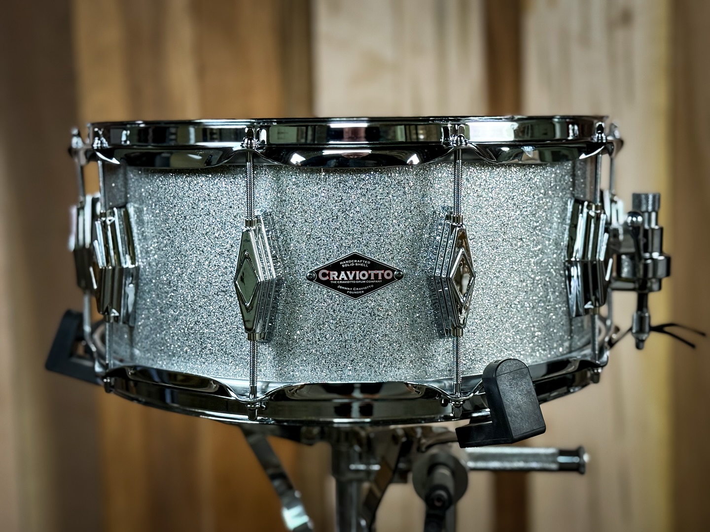 Custom shop 6.5x14 Curly Maple, with 45 degree bearing edges, diamond cast lugs, silver sparkle finish.