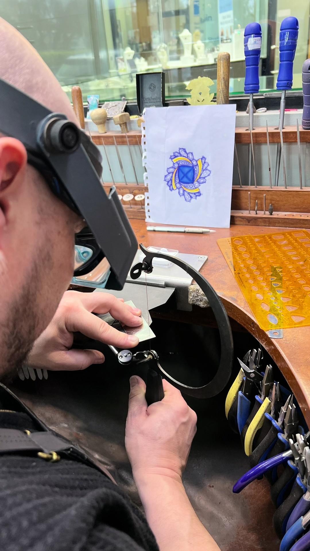 Finalist in the 2025 JAA Australasian Jewellery Awards, our own Andrew Mitchell's piece 'Étoile'...Go behind the scenes in this short video and to vote in the people's choice awards visit the link in our bio.
“It started with a beautiful Tanzanite from our good friend George from Facets Australia. one of those stones you can’t stop looking at, the colour so strong it feels like it has its own light inside. From there I knew the design had to be about movement, something that would echo the energy and depth of the stone itself.
I was struggling to find the right design but while on holiday and having promised not to work, I woke up with the answer. I immediately got up and found some paper and that’s where the turbine/ballerina form came in. Gold and blue, spiralling and circling, catching the light with every turn. Like a dancer.
As a maker, you never feel like a piece is perfect. There’s always something you’d do differently the next time around. But this one carries something special for me, and to have it recognised at this level is a real honour.
I’m proud, excited, and grateful — both for the recognition and for the chance to do what I love every day with the team I get to do it with.”
#JAAawards #jewellerycompetition #artisanjewellery #sugarloafcabochon #tanzanite #australianjeweller #southaustralia #adelaidejeweller #martinrogersjewellery