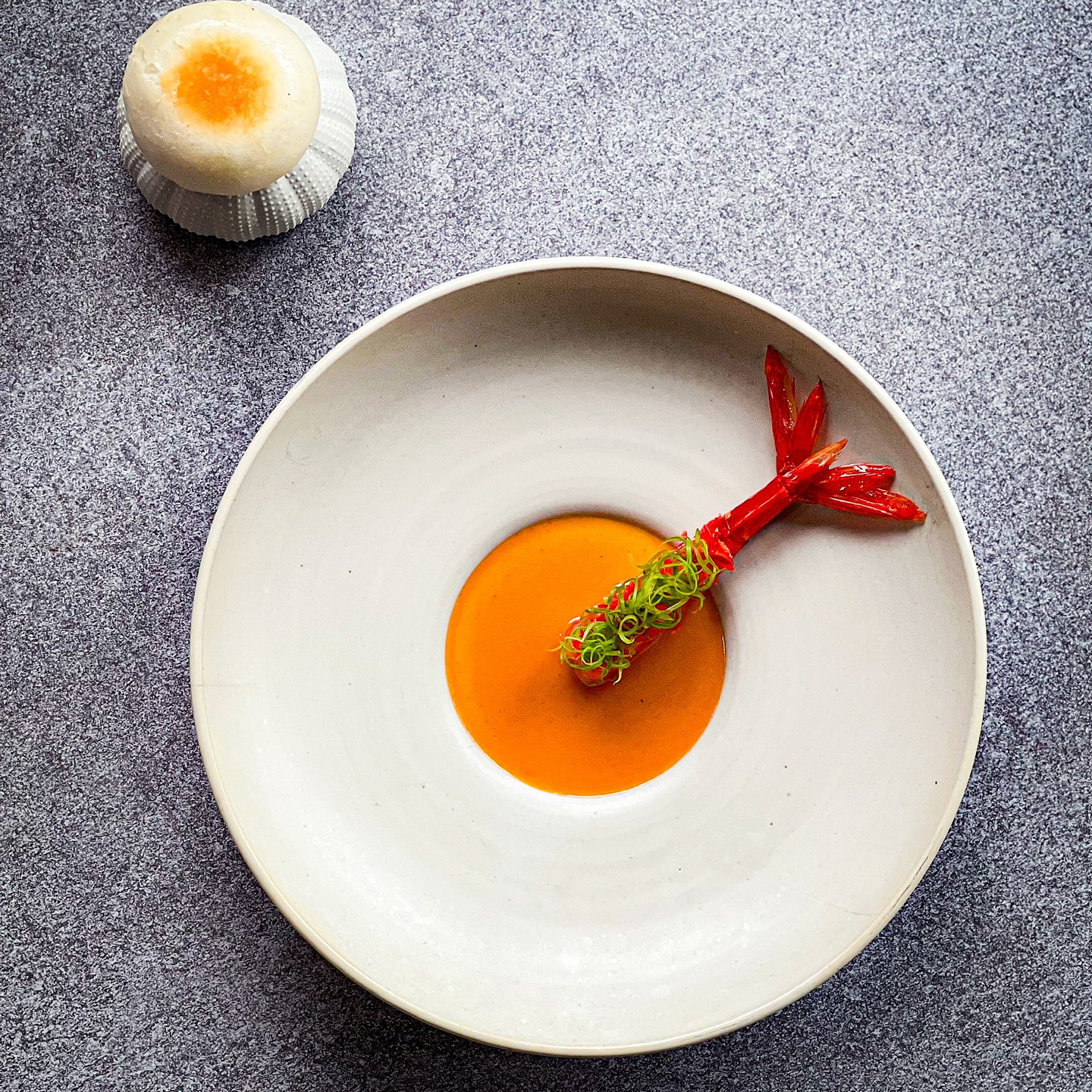 🌊✨ Festive Flavors by the Sea ✨🌊
This holiday season, beneath the shimmering Andaman sky, Chef Maksym invites you to a celebration of seaside fine dining—where premium seafood, sourced from the world’s most pristine waters, is elevated with Phuket’s coastal spirit.
Among the jewels of our festive menu, savor the CARABINERO – Coral Sauce / XO Bao: a crimson Carabinero prawn, bathed in its coral sauce, paired with a delicate XO bao to embrace every drop of ocean-sweetness.
🎄✨ Seats are limited—secure your perfect table by the sea now and let the waves frame your most unforgettable celebration.