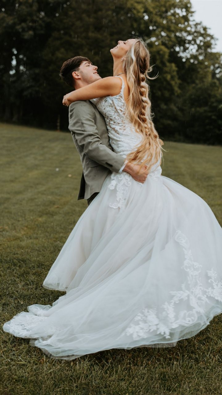 Let the rain add a special touch on your special day!
Faux floral bouquet and boutonniere: @filomenasflorals
Venue, decor, china, floral shades: @farm_at_bentley_fields
Models: @Cody & @nataliagrace02
Hair: @Braids & Blush Caitlin Jacobs Kropschot
Makeup: @flyybeautyy
Attire: @thetrinketsandtreasures
Cakes and cupcakes: trinstastytreats
DJ: @KC Entertainment Event and Wedding DJ
Collaborating Coordinators: @Loveeverafter
Memorable Expressions @Amanda Jean Wright
Photobooth: Akey Photobooth Rentals
Video & content: Juniper Woods Creations
@CrissCross Creatives
Custom name tags and cake topper table numbers:
Memorable Expressions